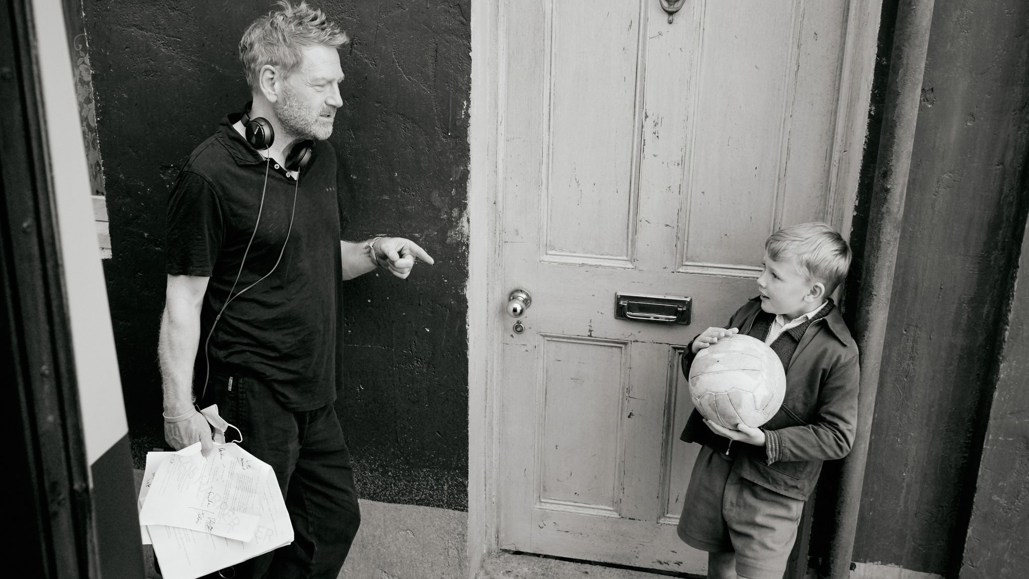 Director Kenneth Branagh (left) and actor Jude Hill (right) on the set of Belfast. Pic: Rob Youngson/Focus Features