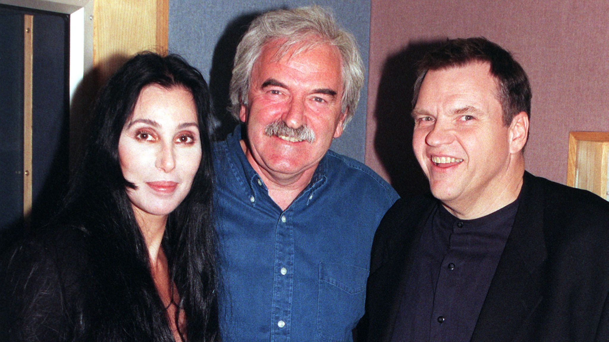 File photo dated 16/10/98 of American singers Cher (left) and Meat Loaf posing for the media with Des Lynam (centre) after they joined him on The Des Lynam Show on BBC Radio 2. US singer Meat Loaf, whose hits included Bat Out of Hell, has died aged 74, a statement on his official Facebook page said. Issue date: Friday January 21, 2022.