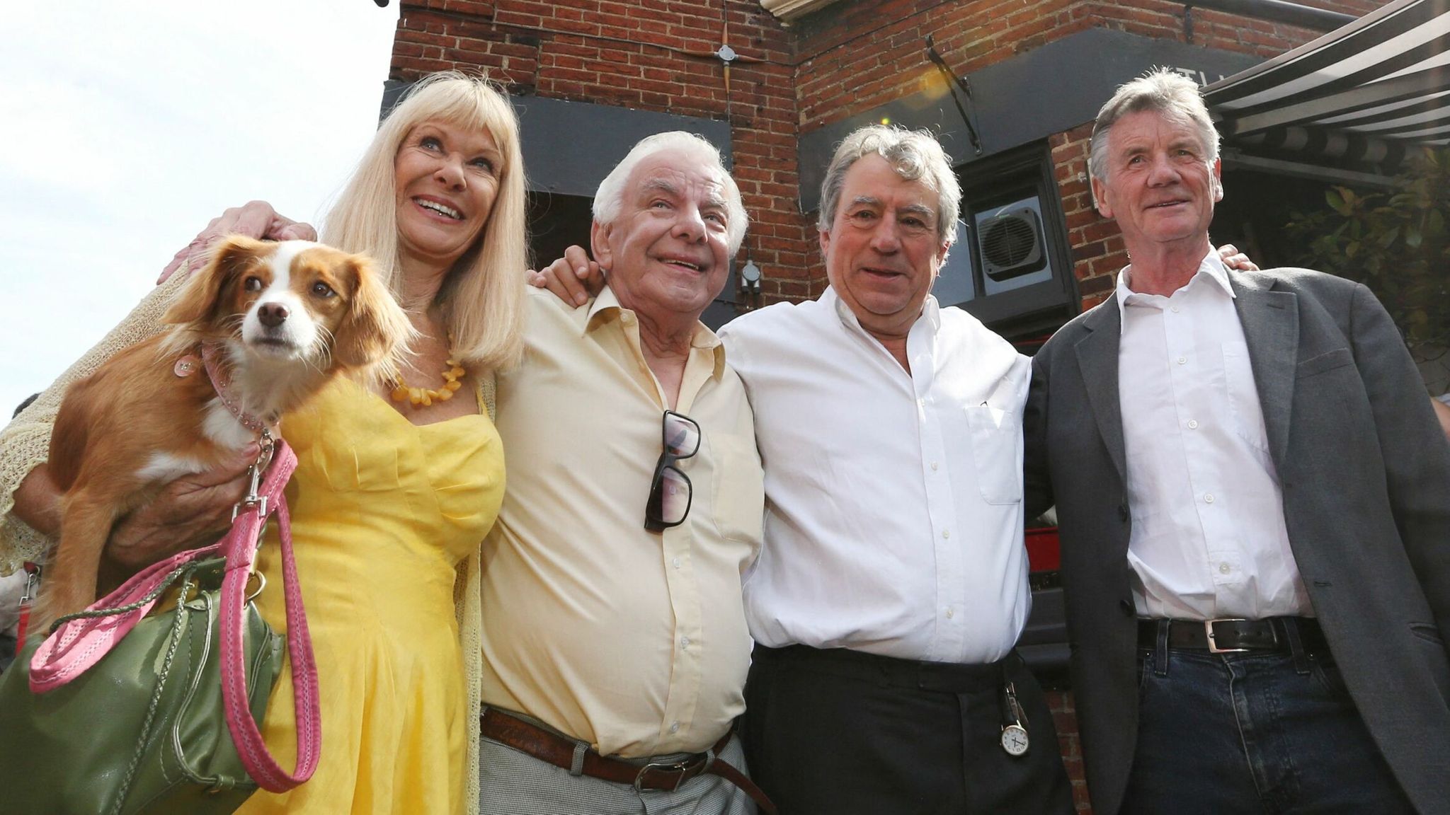 FILE PHOTO: Monty Python&#39;s Flying Circus actors (L-R) Carol Cleveland, former colleague Barry Cryer, actor Terry Jones and Michael Palin pose outside the Angel pub in Highgate, north London September 6, 2012. A blue plaque organised by friends and family was unveiled to former Monty Python star Graham Chapman following news that English Heritage had dropped plans for an &#39;official&#39; Blue Plaque to the star, due to budget cuts. Chapman drank, wrote and was barred from the Angel pub in the 1970s. RE