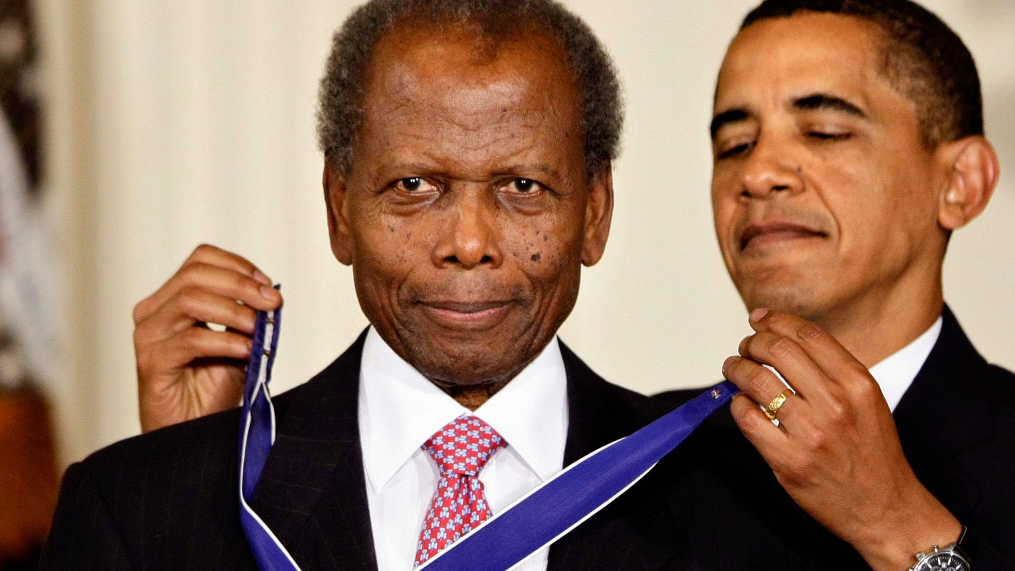 Pic: AP President Barack Obama presents the 2009 Presidential Medal of Freedom to Sidney Poitier during ceremonies in the East Room at the White House in Washington, Wednesday, Aug. 12, 2009. (AP Photo/J. Scott Applewhite)