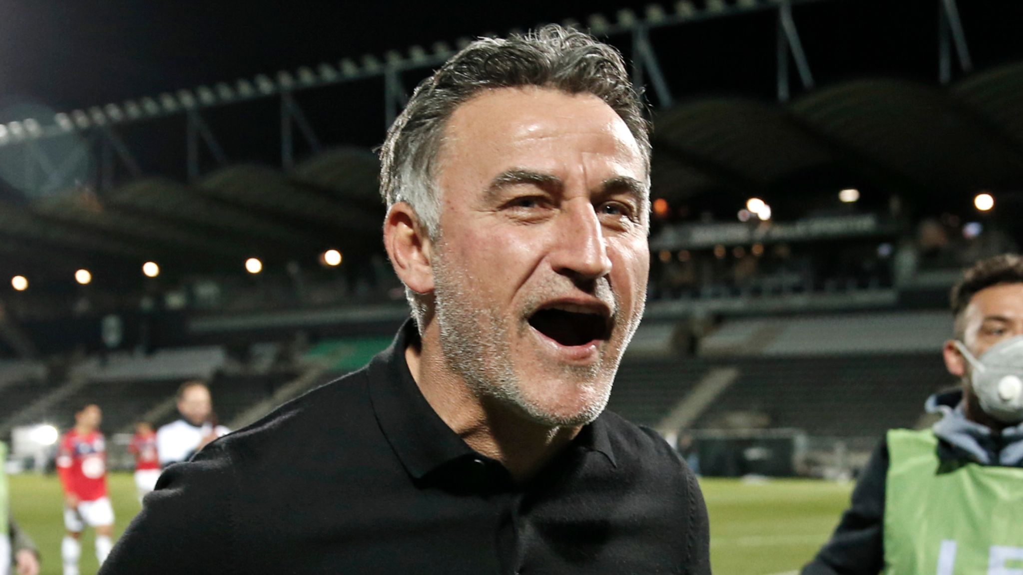 Lille&#39;s head coach Christophe Galtier celebrates after the French League One soccer match between Angers and Lille at the Raymond Kopa Stadium in Angers, France, Sunday May 23, 2021. Lille won the match 2-1 to clinch the French League One title. (AP Photo/Lewis Joly)
