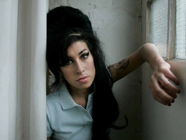 ritish singer Amy Winehouse poses for photographs after being interviewed by The Associated Press at a studio in north London, Feb. 16, 2007. 