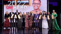 NEW YORK, NEW YORK - DECEMBER 11: (L-R) Carie Broecker, Richard Casper, Tyrique Glasgow, Nora El-Khouri Spencer, Kelly Ripa, CNN Hero of the Year Nelly Cheboi, Christina Cheboi Chebii, Anderson Cooper, Aidan Reilly, Meymuna Hussein-Cattan, Teresa Gray, Bobby Wilson, and Debra Vines pose onstage during the 16th annual CNN Heroes: An All-Star Tribute at the American Museum of Natural History on December 11, 2022 in New York City. (Photo by Mike Coppola/Getty Images for CNN)