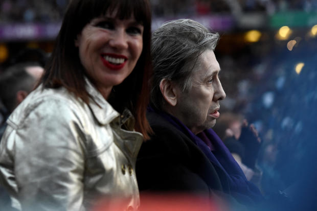 FILE PHOTO: Musician Shane MacGowan watches as U2 perform during their U2: The Joshua Tree Tour, at Croke Park, Dublin 