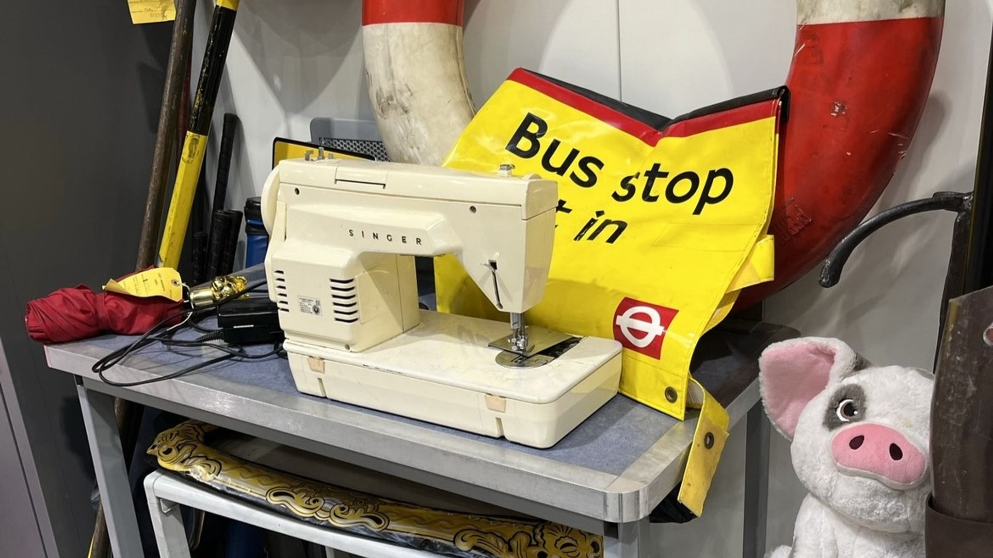 A sewing machine sits in the office&#39;s section for older stuff