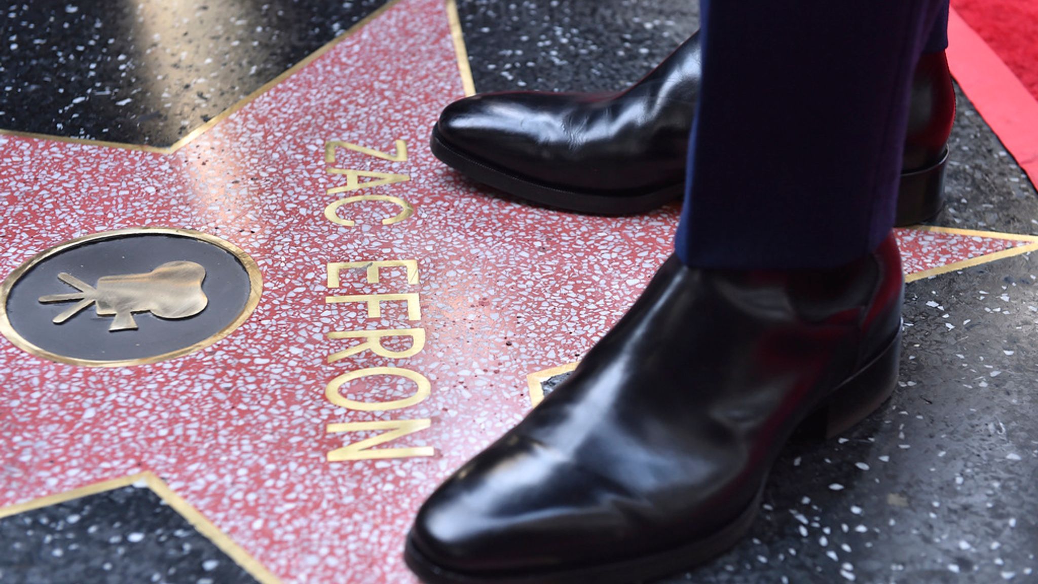 Zac Efron attends a ceremony honoring him with a star on the Hollywood Walk of Fame on Monday, Dec. 11, 2023, in Los Angeles. (Photo by Jordan Strauss/Invision/AP)