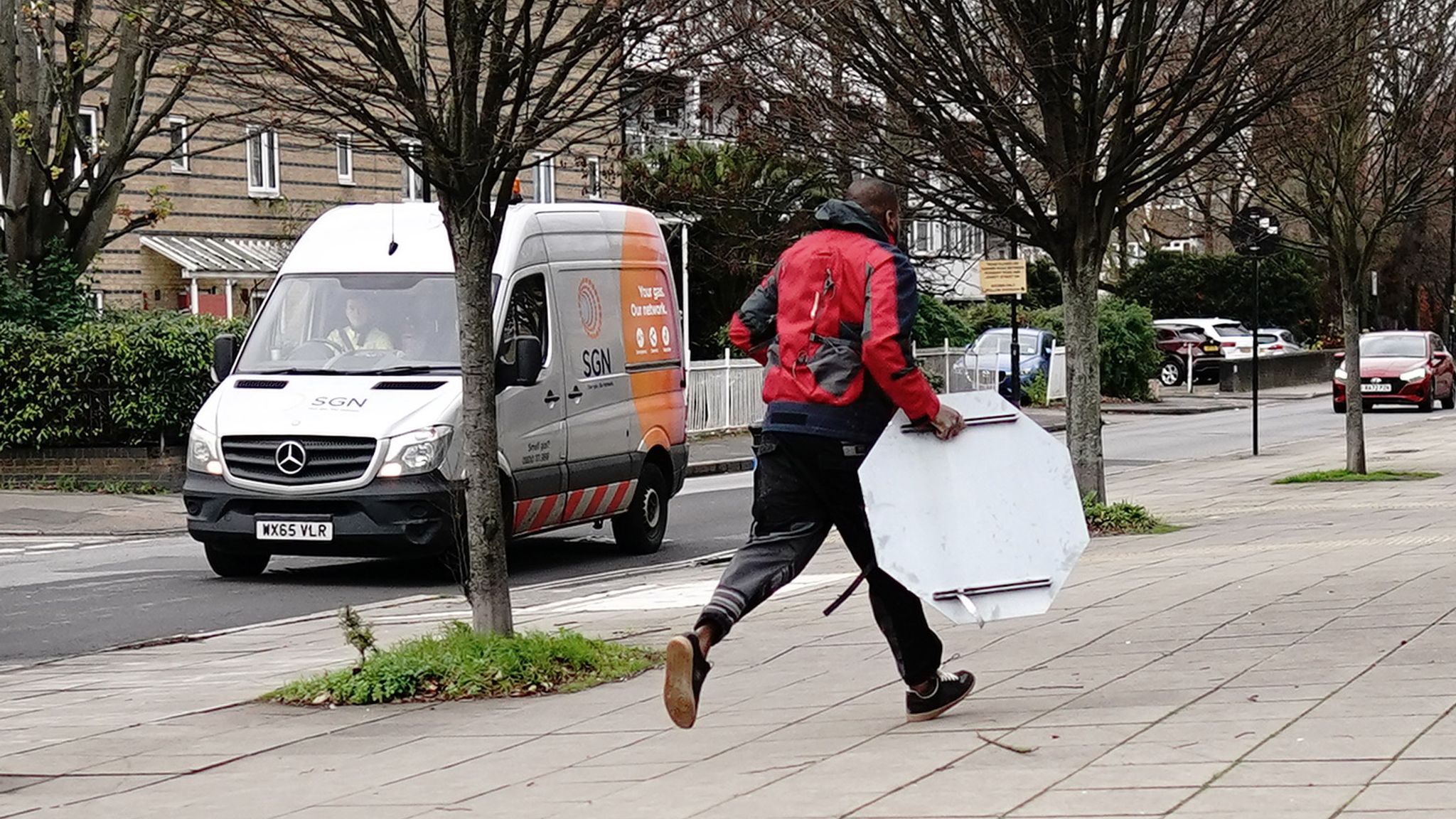 A person removes the Banksy artwork