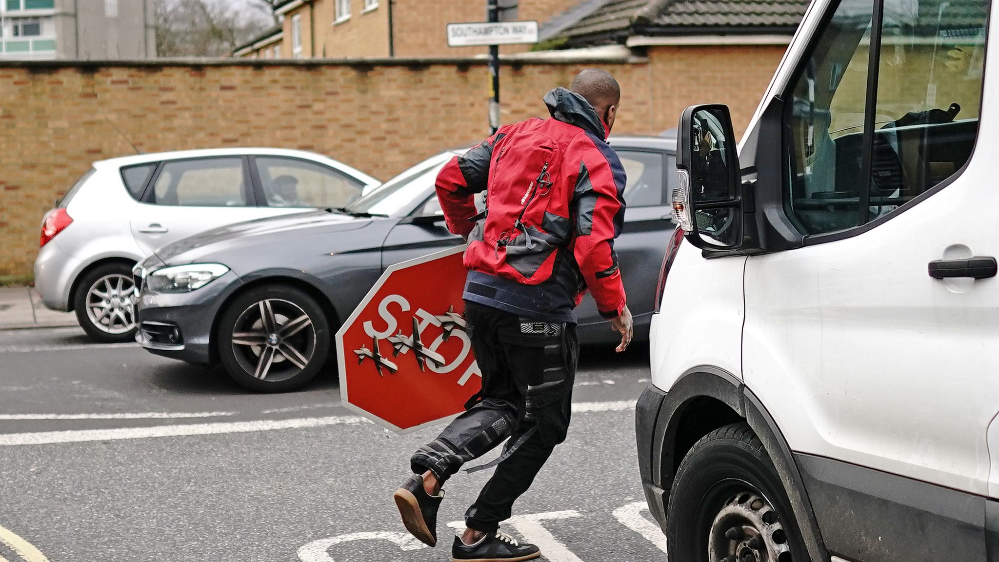 A person removes the Banksy artwork