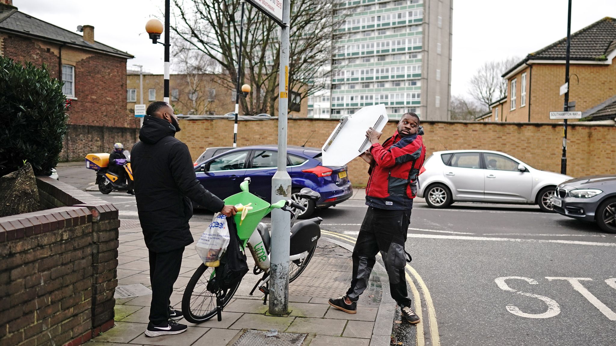 A person removes the Banksy artwork