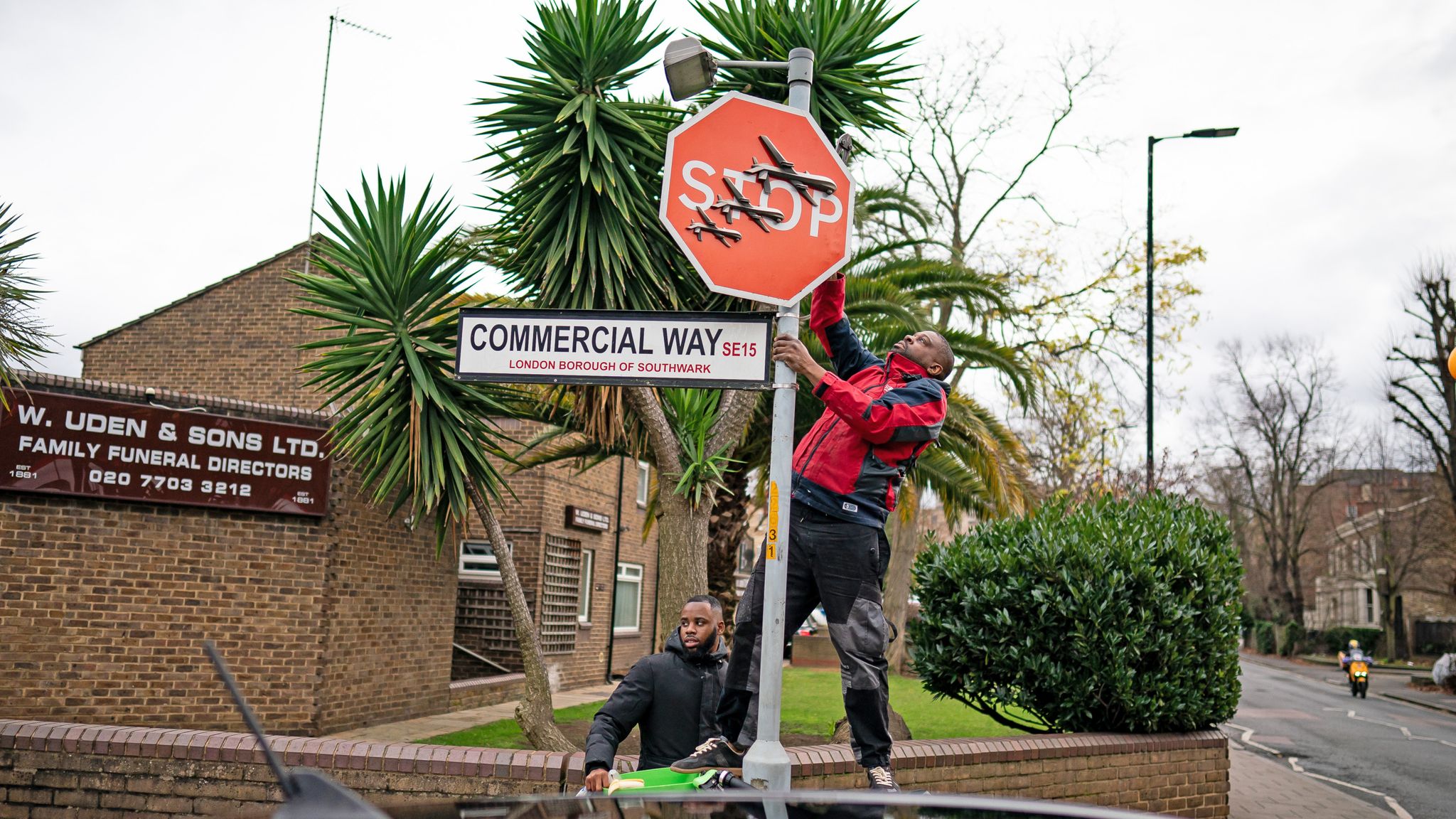 A person removes the Banksy artwork