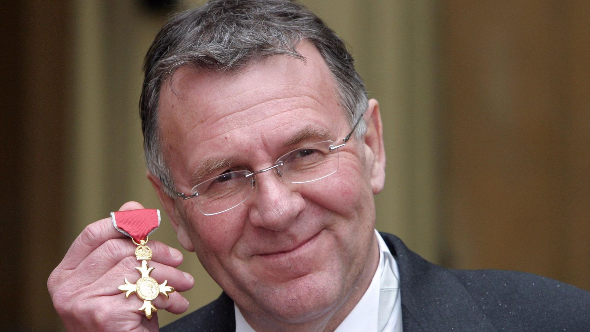 Actor Tom Wilkinson, after he collected an OBE from Britain&#39;s Queen Elizabeth II in 2005