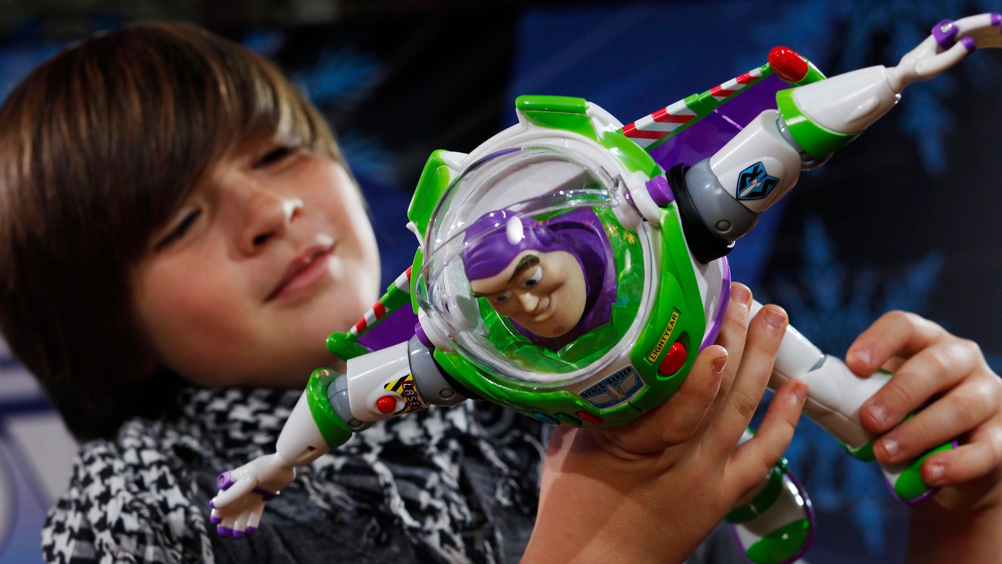 Kailum Alden, aged 9 with Jet Pack Buzz Lightyear, Mattel UK (..39.99) .which has been predicted to be one of the top twelve toys this Christmas at the Toy Retailers Association...s (TRA) Dream Toys 2010 media preview, St Mary...s Church, Marylebone, London. PRESS ASSOCIATION Photo. Picture date: Wednesday October 27, 2010. The 2010 annual Dream Toys list from the TRA, the industry...s official prediction of Christmas best-sellers, is packed full of kiddie versions of adult must-haves. Photo credit should read: David Parry/PA Wire.