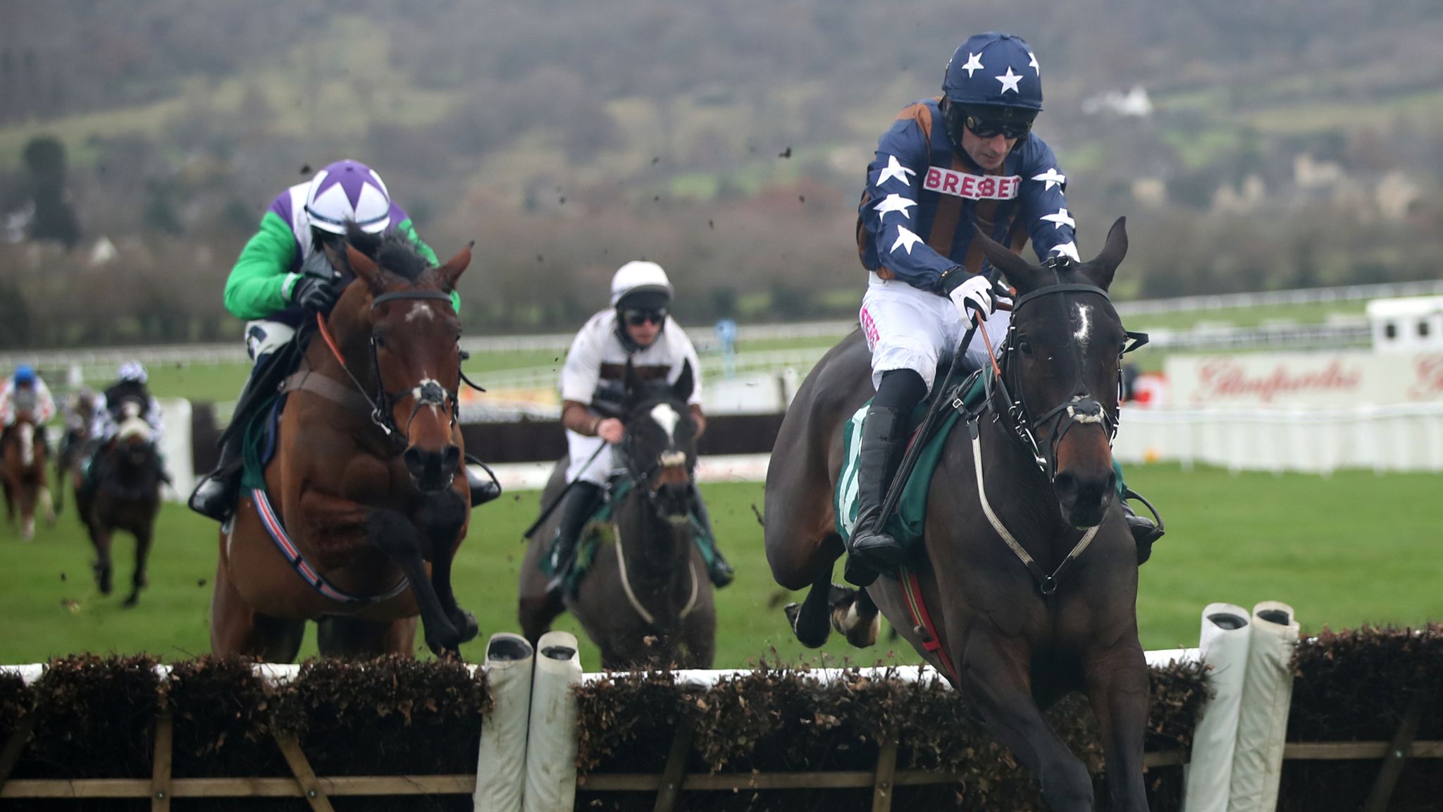 Dysart Enos ridden by Paddy Brennan jumps the last before winning the British EBF "National Hunt" Novices&#39; Hurdle during day one of the The Christmas Meeting at Cheltenham