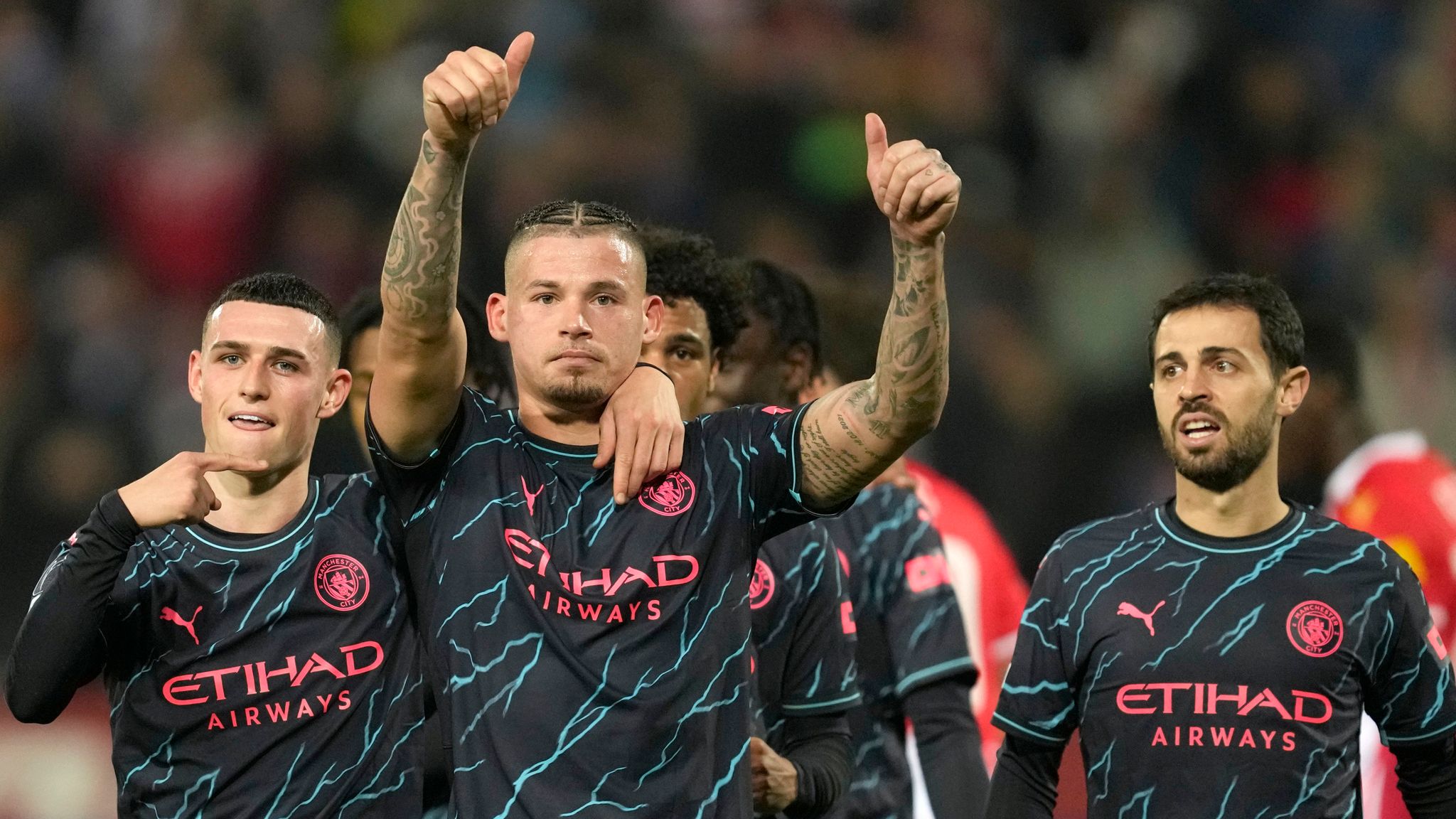 Manchester City's Kalvin Phillips, centre, celebrates after scoring his side's third goal during the Group G Champions League soccer match between Red Star and Manchester City, at the Rajko Mitic Stadium in Belgrade, Serbia, Wednesday, Dec. 13, 2023. (AP Photo/Darko Vojinovic)