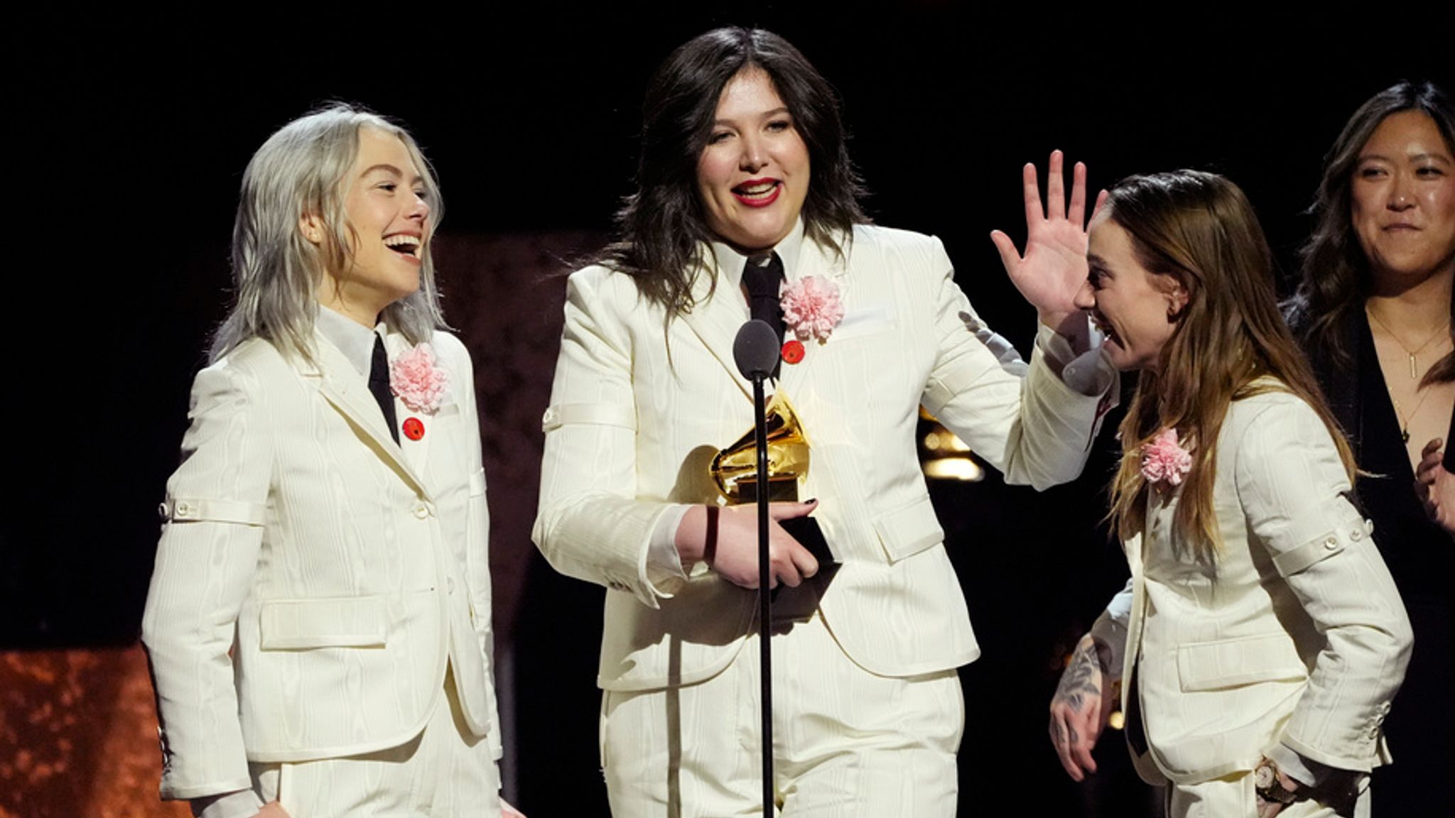 Phoebe Bridgers, from left, Lucy Dacus and Julien Baker, of boygenius accept the award for best rock performance "Not Strong Enough" during the 66th annual Grammy Awards on Sunday, Feb. 4, 2024, in Los Angeles. (AP Photo/Chris Pizzello)