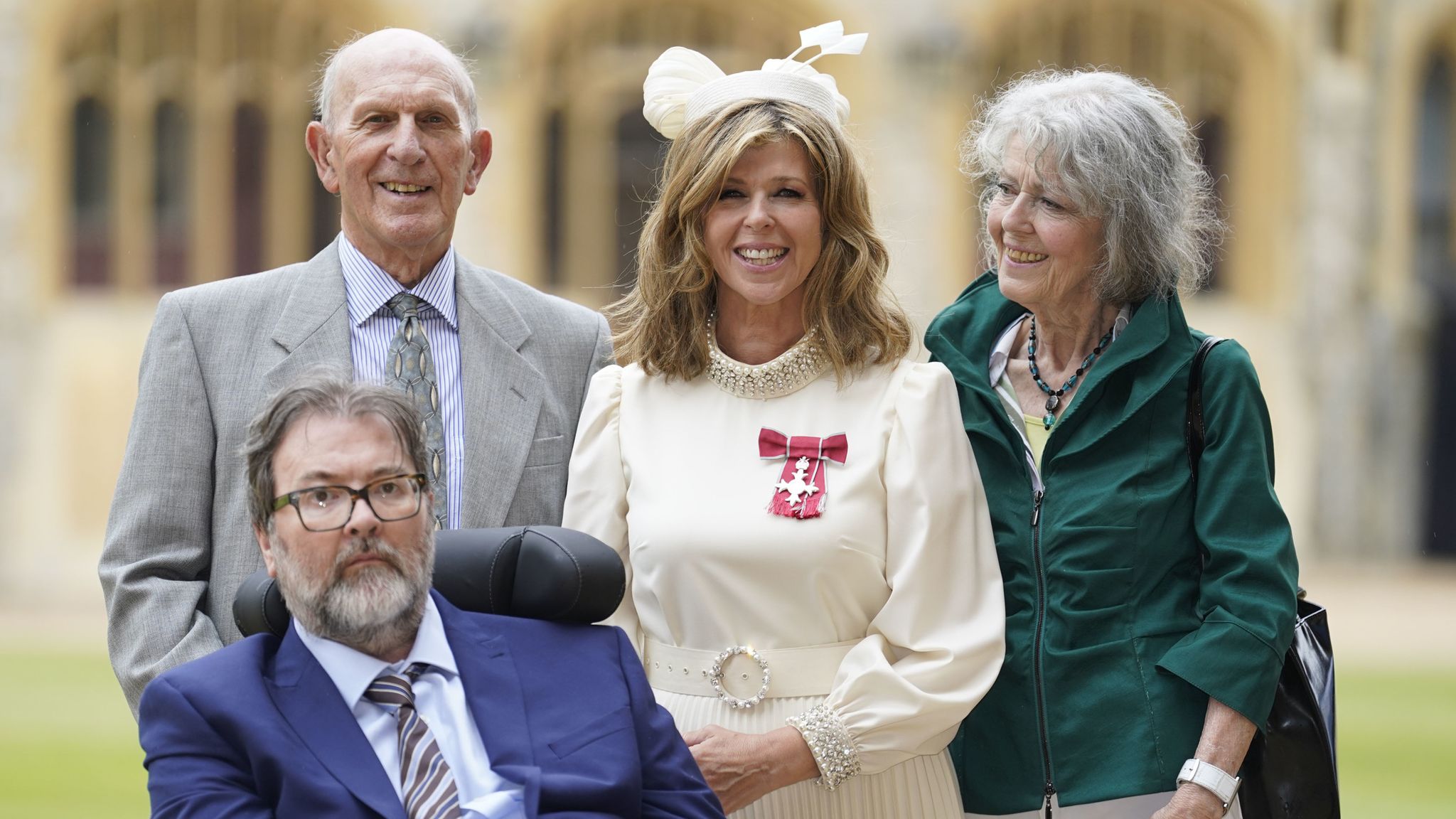 Kate Garraway, with her husband Derek Draper and her parents Gordon and Marilyn Garraway, after being made a Member of the Order of the British Empire for her services to broadcasting, journalism and charity by the Prince of Wales during an investiture ceremony at Windsor Castle, Berkshire. Picture date: Wednesday June 28, 2023.