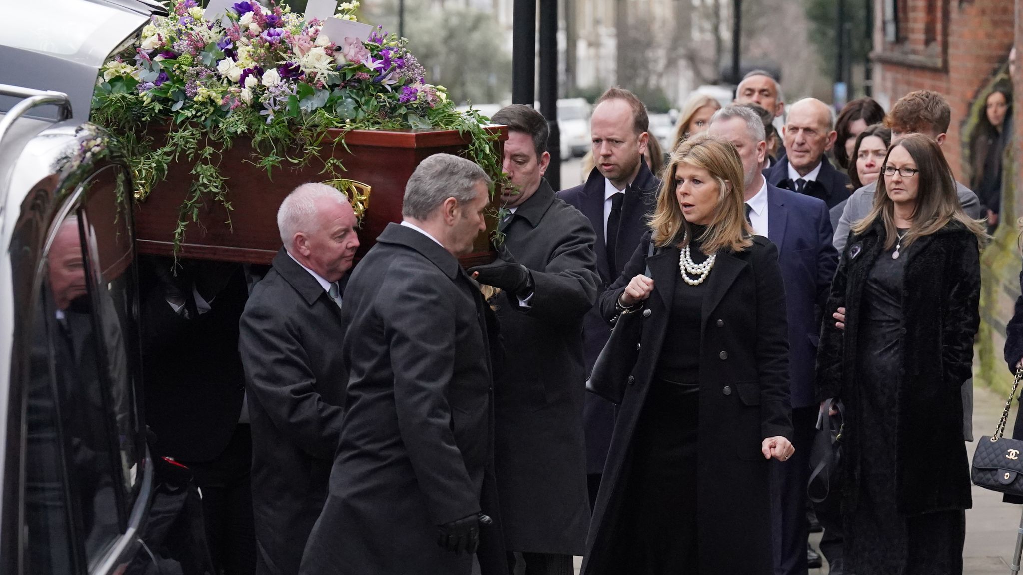 Pic: PA Kate Garraway accompanies the coffin into the funeral service of her husband Derek Draper at St Mary the Virgin church in Primrose Hill, north west London. The former lobbyist turned psychologist and author, who married presenter Kate Garraway in 2005, died last month following long-lasting symptoms from coronavirus. Picture date: Friday February 2, 2024.