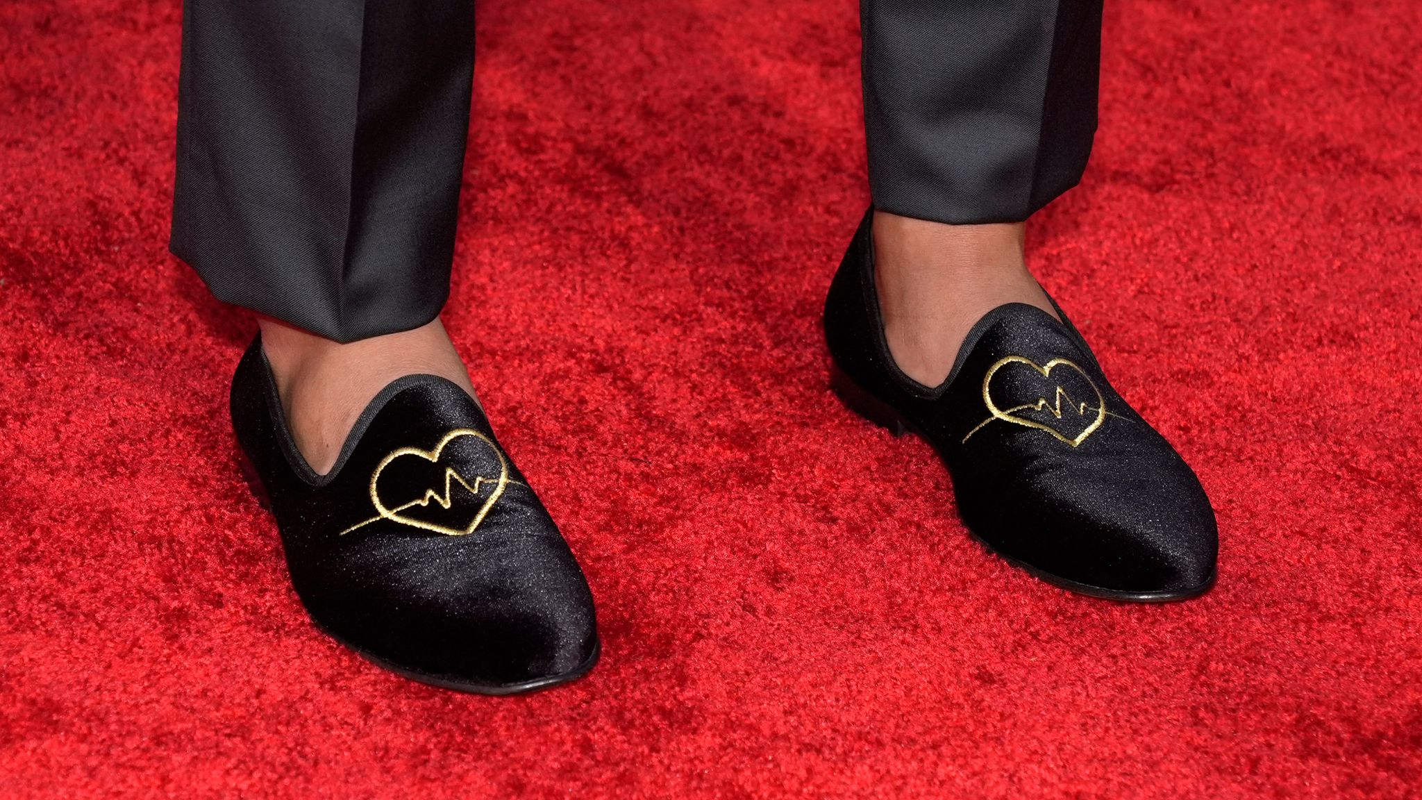 Damar Hamlin of the Buffalo Bills poses on the red carpet at the NFL Honors award show ahead of the Super Bowl 58 football game Thursday, Feb. 8, 2024, in Las Vegas. The San Francisco 49ers face the Kansas City Chiefs in Super Bowl 58 on Sunday. (AP Photo/Charlie Riedel)