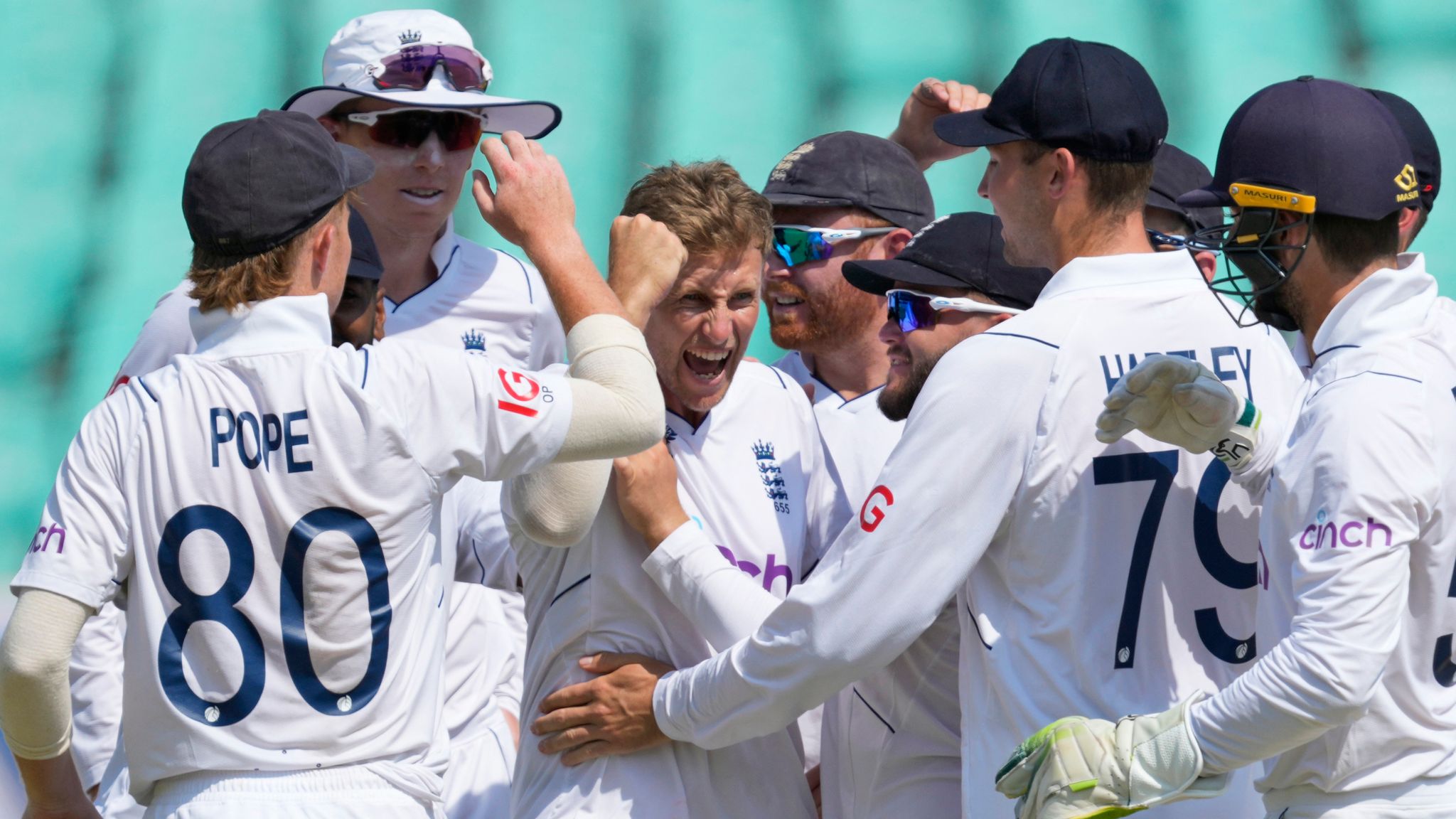 England's Joe Root celebrates the wicket of Rohit Sharma in Rajkot