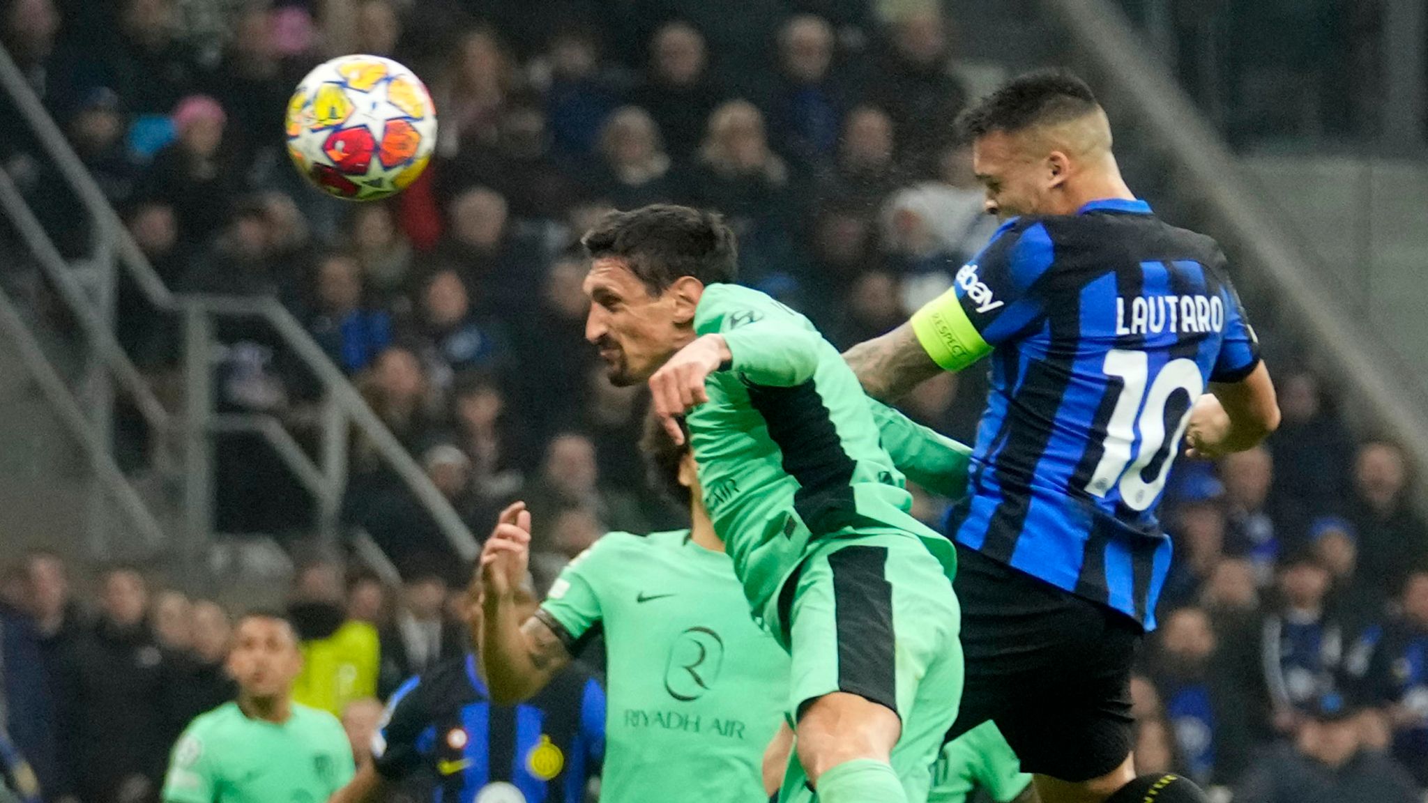 Lautaro Martinez and Stefan Savic challenge for the ball