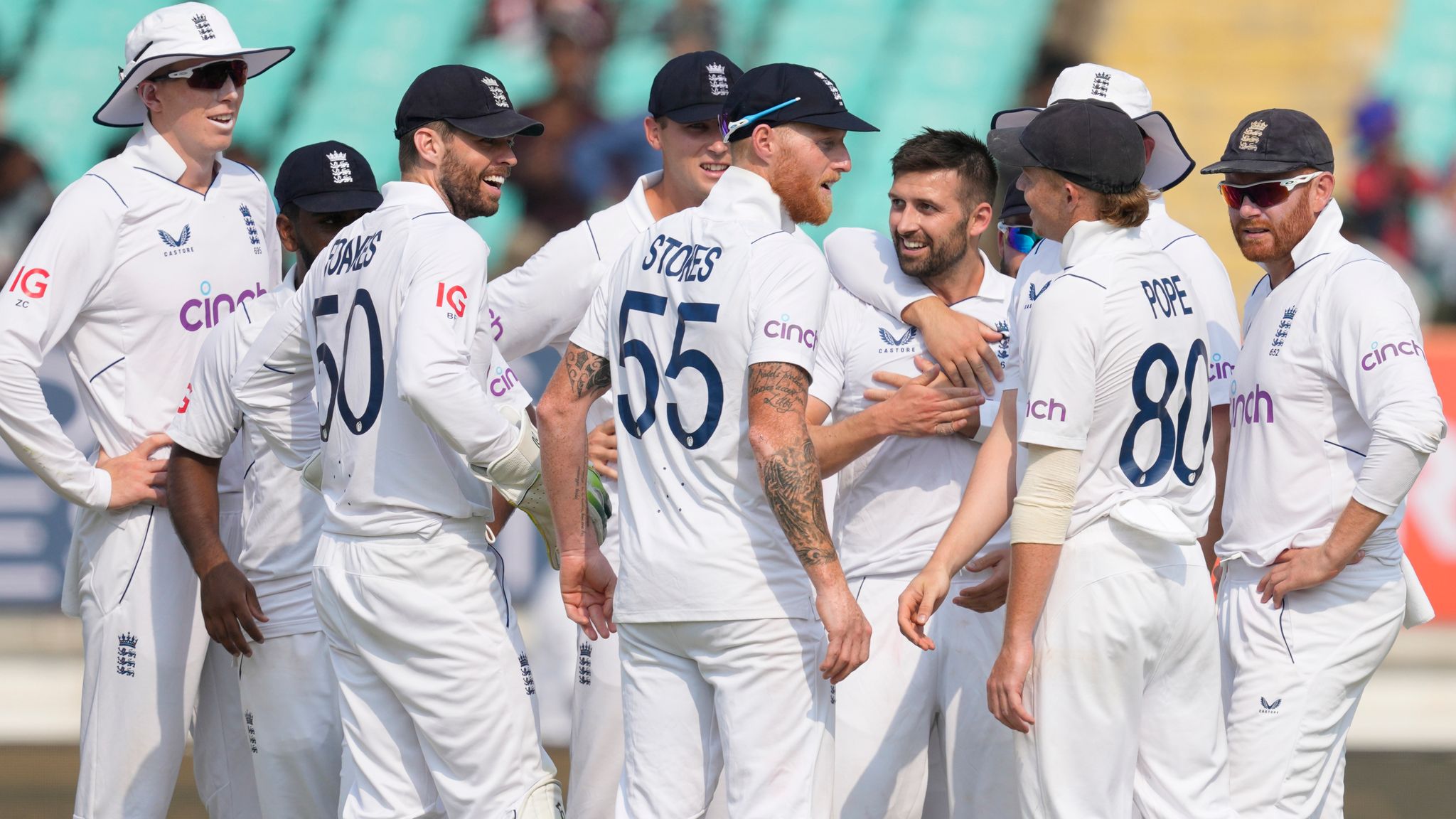 England's players celebrate the wicket of India's captain Rohit Sharma 