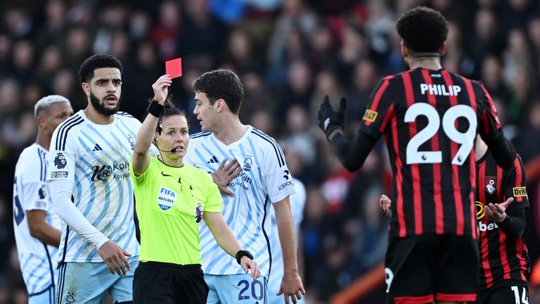 Referee Rebecca Welch shows a red card to Philip Billing