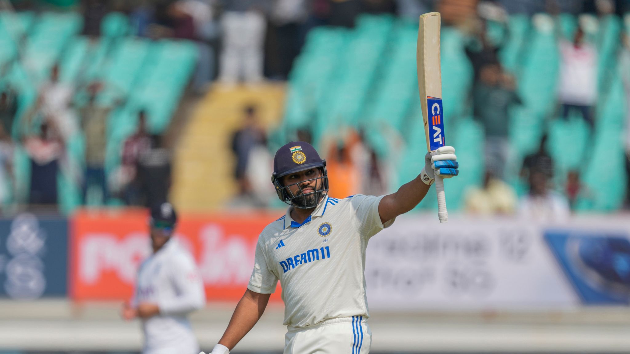 India's captain Rohit Sharma celebrates his third hundred against England