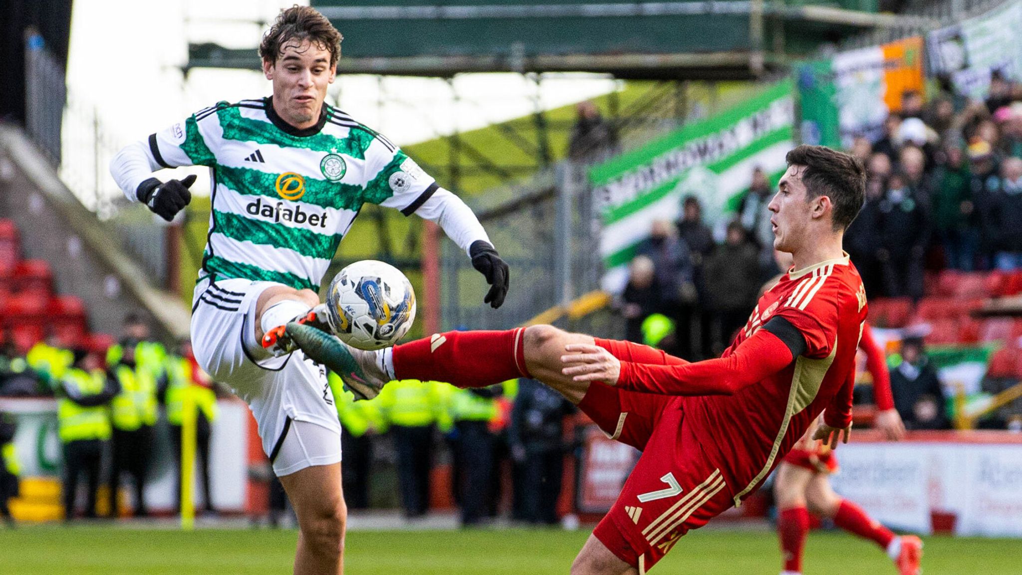 Paulo Bernardo and Jamie McGrath battle for the ball