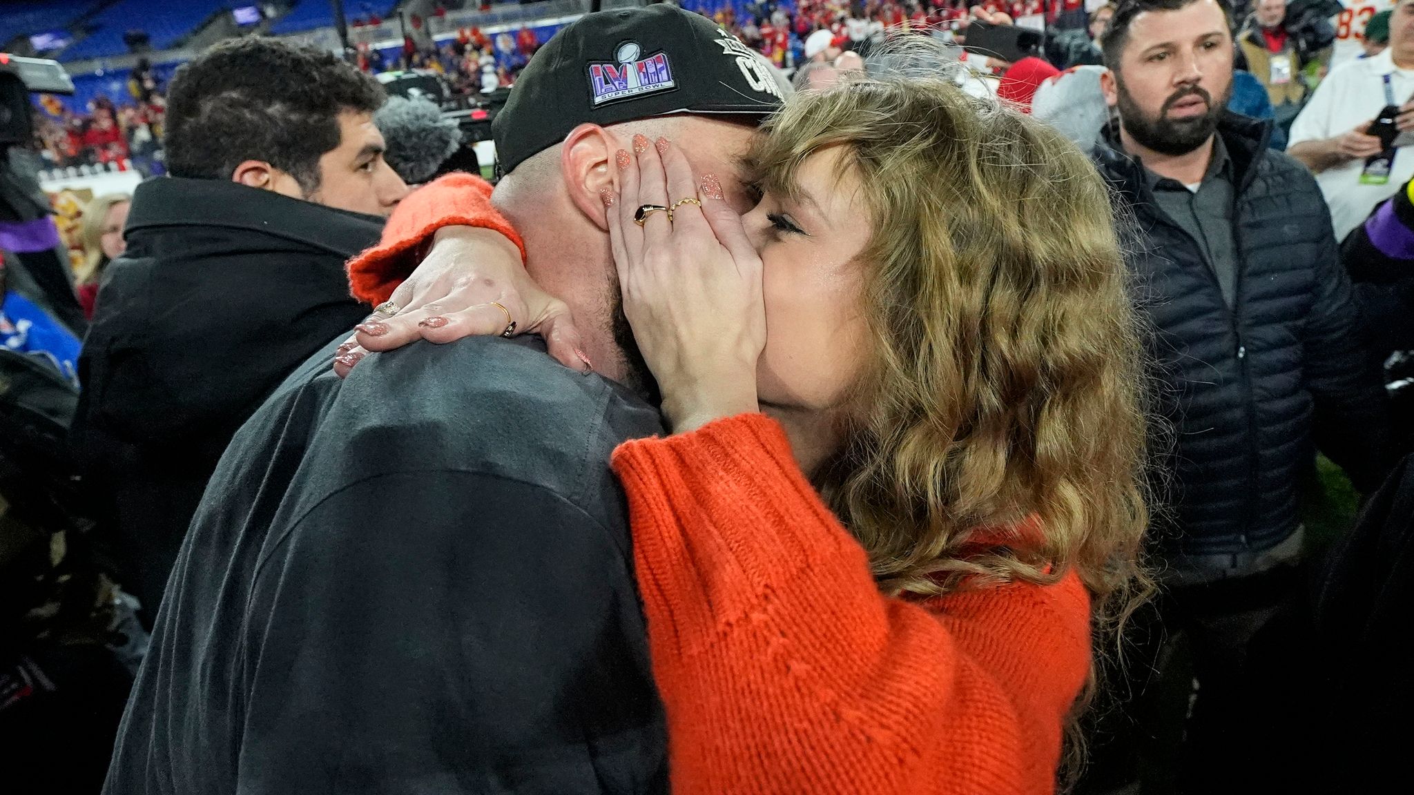 Taylor Swift speaks with Kansas City Chiefs tight end Travis Kelce after an AFC Championship NFL football game against the Baltimore Ravens, Sunday, Jan. 28, 2024, in Baltimore. The Kansas City Chiefs won 17-10. (AP Photo/Julio Cortez)