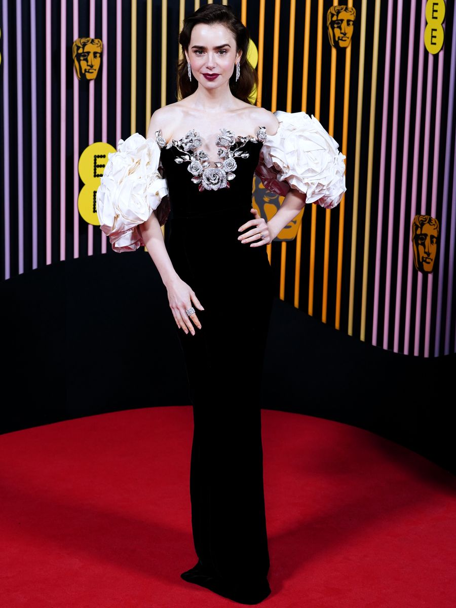 Lily Collins in a blooming monochrome velvet gown. PA Wire