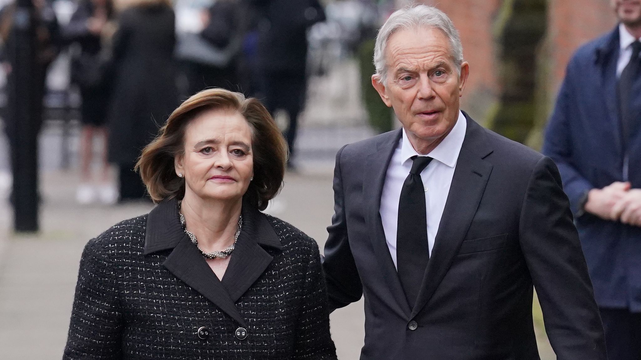 Pic: PA Former prime minister Tony Blair and his wife Cherie Blair attend the funeral service of Derek Draper at St Mary the Virgin church in Primrose Hill, north west London. The former lobbyist turned psychologist and author, who married presenter Kate Garraway in 2005, died last month following long-lasting symptoms from coronavirus. Picture date: Friday February 2, 2024.