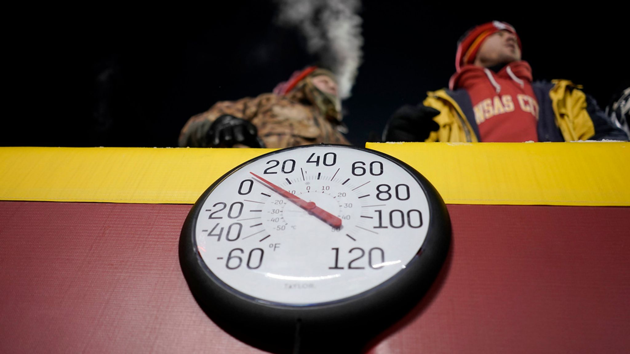 FILE - A gauge displays the temperature on the field at Arrowhead Stadium during the first half of an NFL wild-card playoff football game between the Kansas City Chiefs and the Miami Dolphins, Jan. 13, 2024, in Kansas City, Mo. Some of the people who attended the near-record cold Chiefs playoff game in January had to undergo amputations, a Missouri hospital said Friday, March 8, 2024. Research Medical Center didn...t provide exact numbers but said in a statement Friday that some of the 12 people who had to undergo amputations after the cold snap had been at the game. (AP Photo/Charlie Riedel, File)