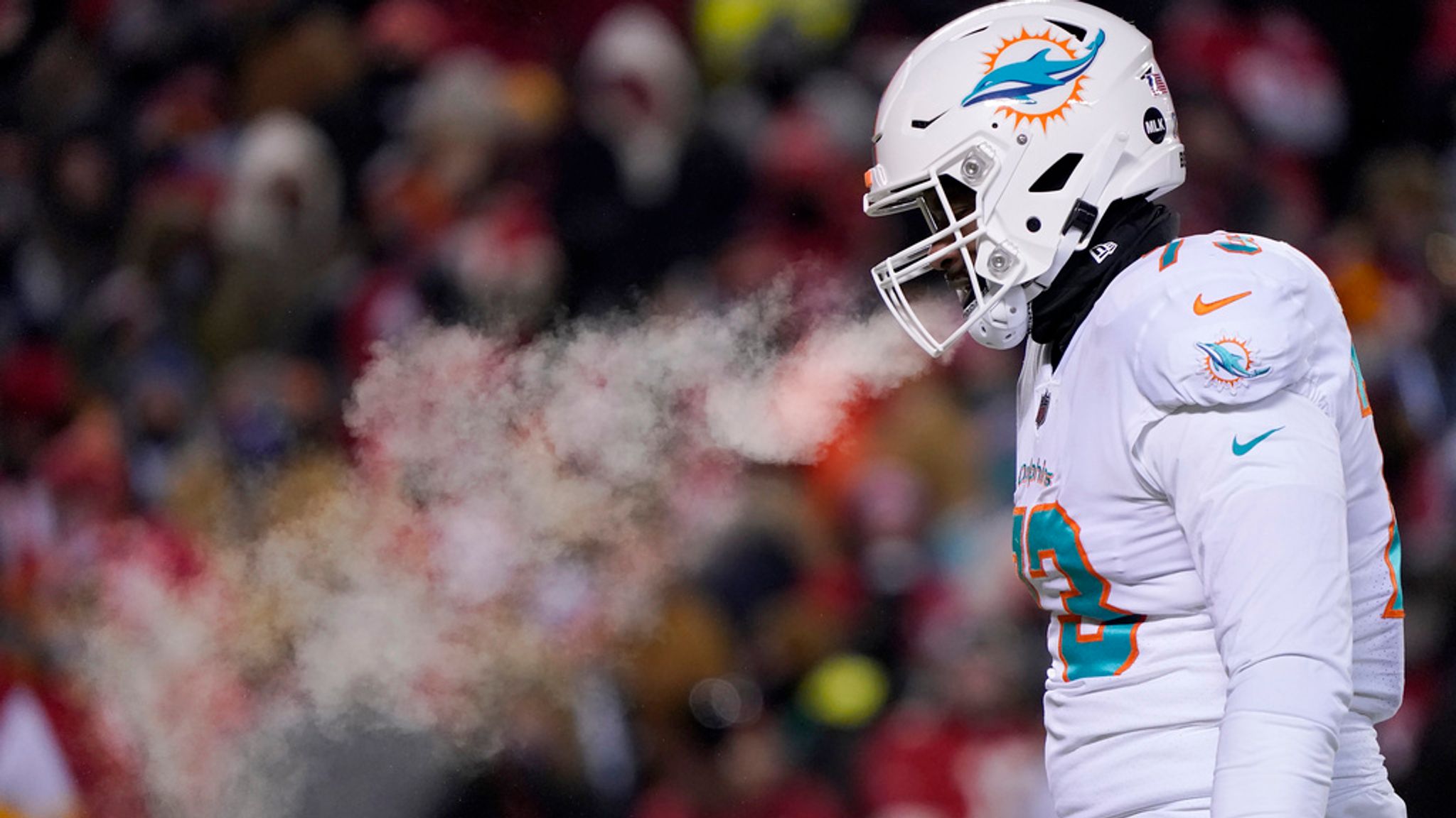 FILE - Miami Dolphins guard Austin Jackson walks on the field during the first half of the team&#39;s NFL wild-card playoff football game against the Kansas City Chiefs on Jan. 13, 2024, in Kansas City, Mo. While the U.S. is shivering through bone-chilling cold, most of the rest of world is feeling unusually warm weather. Scientists Tuesday, Jan. 16, say that fits with what climate change is doing to Earth. (AP Photo/Ed Zurga, File)