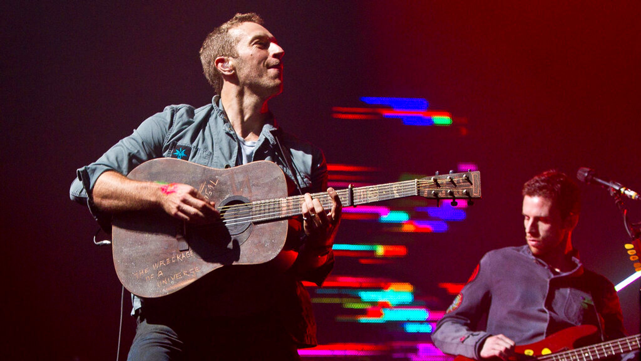 British singer Chris Martin of Coldplay performs on the Pyramid stage at Glastonbury Music Festival, Saturday, June 25, 2011. More than 170,000 ticket-holders have arrived at Worthy Farm for the 41st festival. (AP Photo/Joel Ryan) 