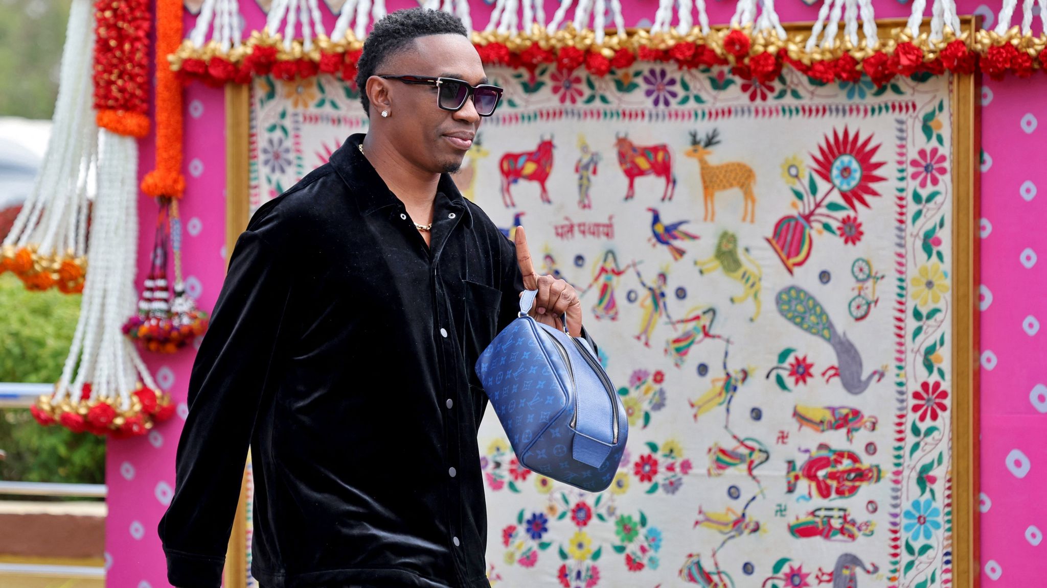 West Indies&#39; cricketer Dwayne Bravo arrives to attend pre-wedding celebrations of Anant Ambani and Radhika Merchant. Pic: Reuters