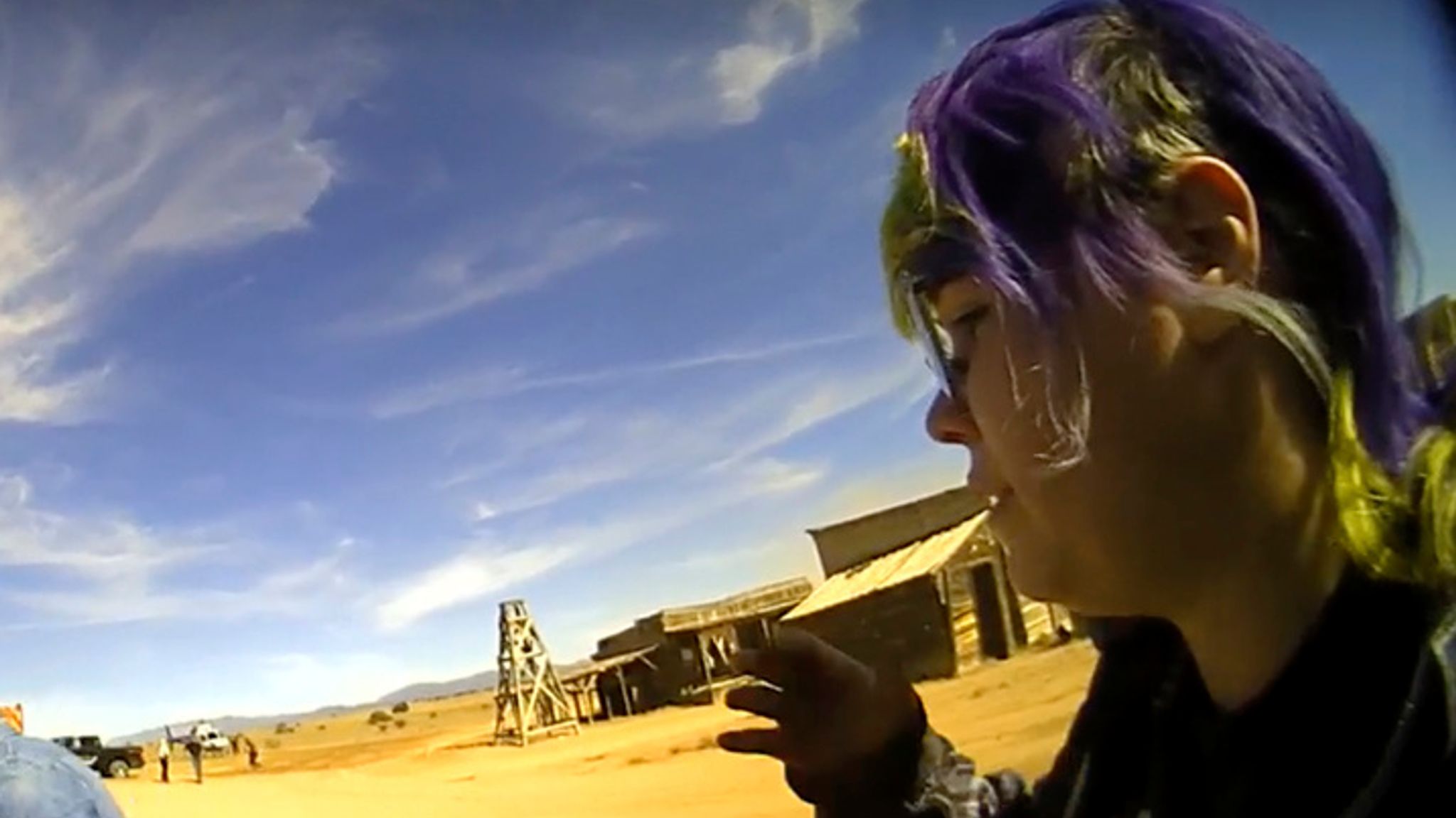 In this screen grab from lapel camera video provided by the Santa Fe County Sheriff&#39;s Office, movie set armorer Hannah Gutierrez-Reed, right, speaks with a sheriff&#39;s deputy as other colleagues, at center and left, react on the set of the western move "Rust," shortly after the fatal shooting of cinematographer Halyna Hutchins by Alec Baldwin during a rehearsal, Oct. 21, 2021, in New Mexico. The scheduled trial next week of the movie weapons supervisor in the fatal shooting of a cinematographer by Alec Baldwin may hinge on an enduring mystery: How did live ammunition find its way onto the set of a film set where it was expressly prohibited? (Santa Fe County Sheriff&#39;s Office via AP)