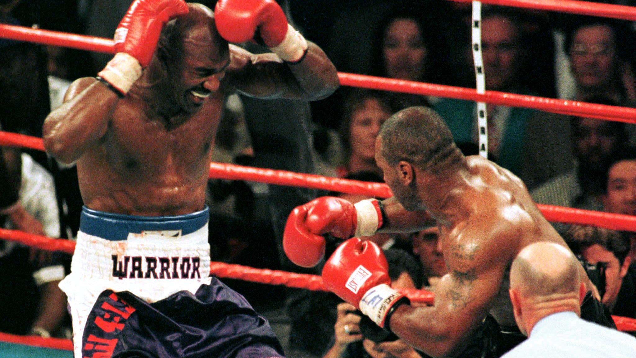 Holyfield reacts after having part of his ear bitten off. Pic: Reuters