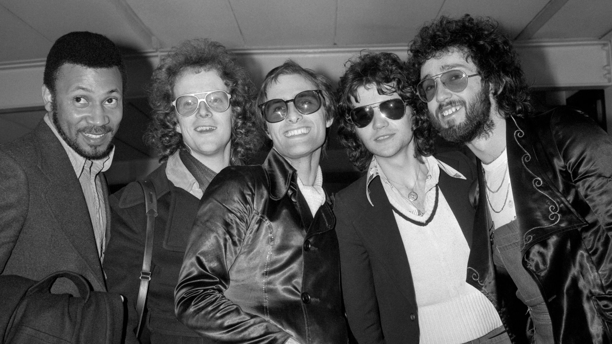 File photo dated 26/02/75 of Steve Harley (centre) and Cockney Rebel, when they were top of the best selling pop charts with "Make Me Smile (Come Up And See Me)", at London&#39;s Heathrow airport on their arrival from America and two-week tour of one-night stands. Cockney Rebel frontman Steve Harley has died peacefully at home at the age of 73, his family has announced. Issue date: Sunday March 17, 2024.