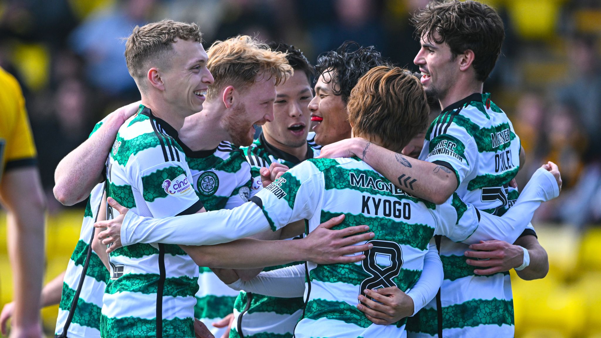 Celtic players celebrate after taking the lead at Livingston through a Jamie Brandon own goal