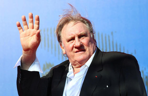 FILE PHOTO: Gerard Depardieu waves as he arrives during a red carpet event for the movie "Novecento- Atto Primo" at the 74th Venice Film Festival in Venice 