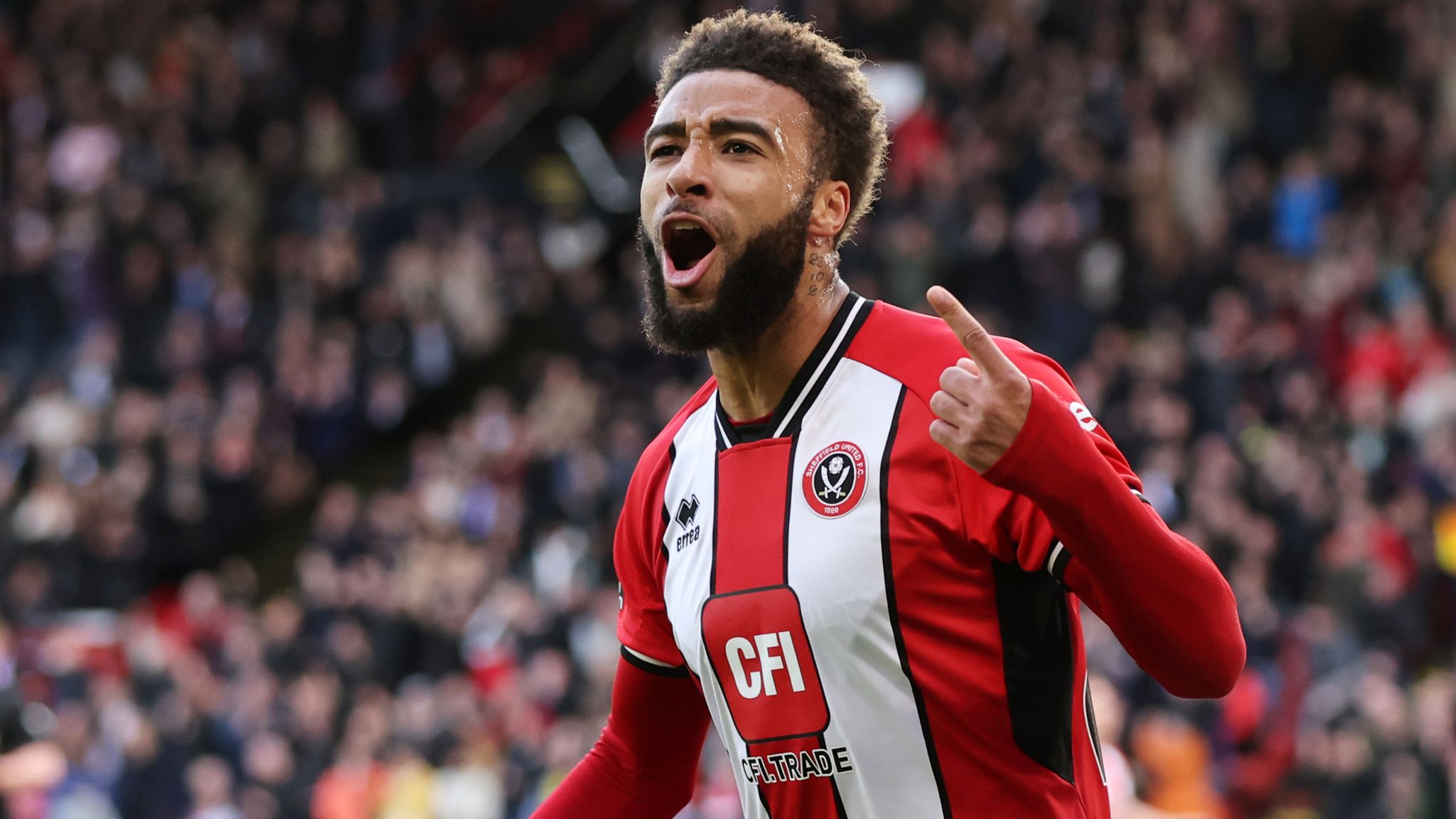 Jayden Bogle of Sheffield United celebrates scoring his team's equaliser