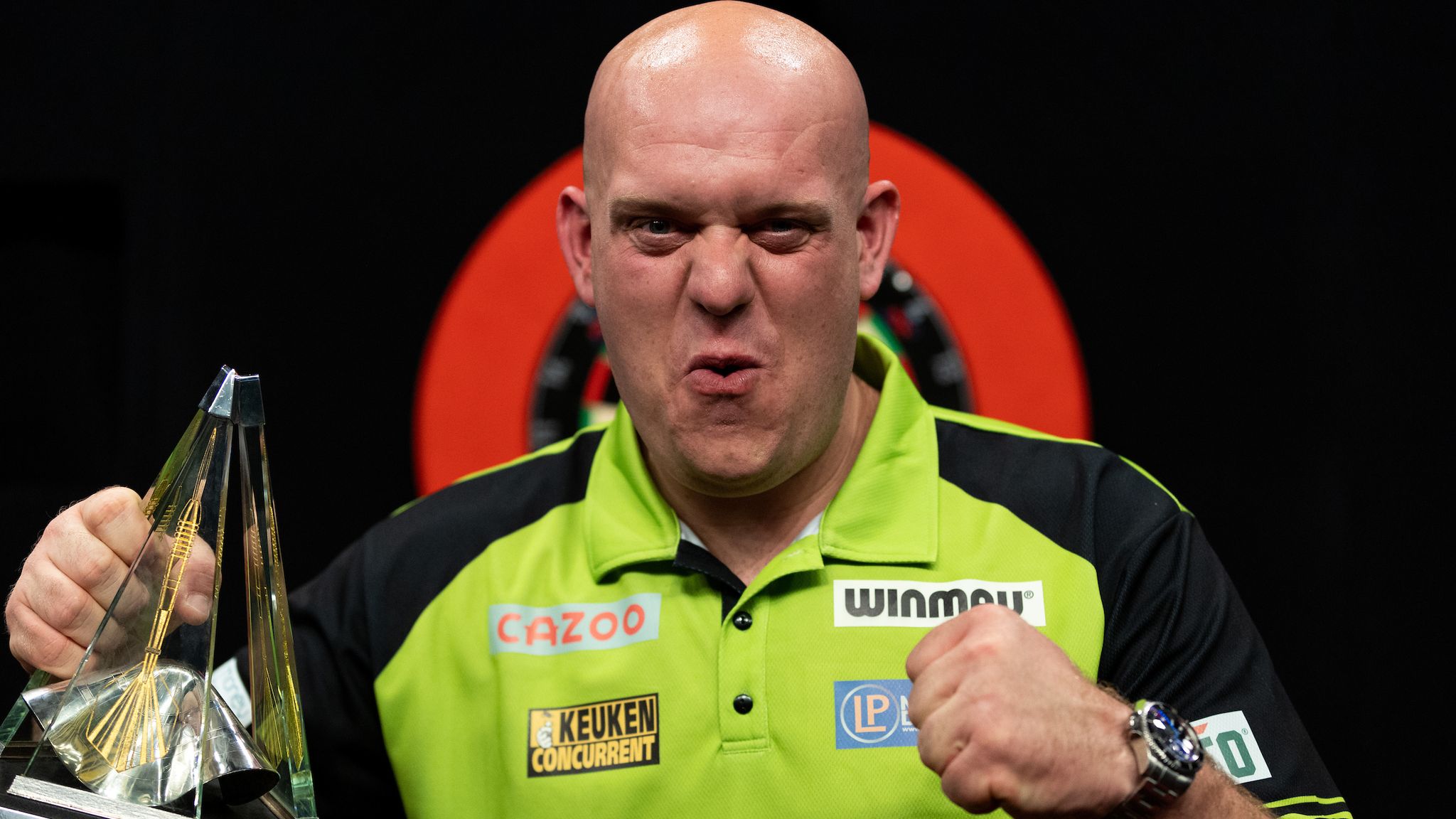 Michael Van Gerwen celebrates with the trophy after winning against Gerwyn Price in the final during the Cazoo Premier League Play-Offs. Photo credit should read: Steven Paston/PDC ..RESTRICTIONS: Use subject to restrictions. Editorial use only, no commercial use without prior consent from rights holder.