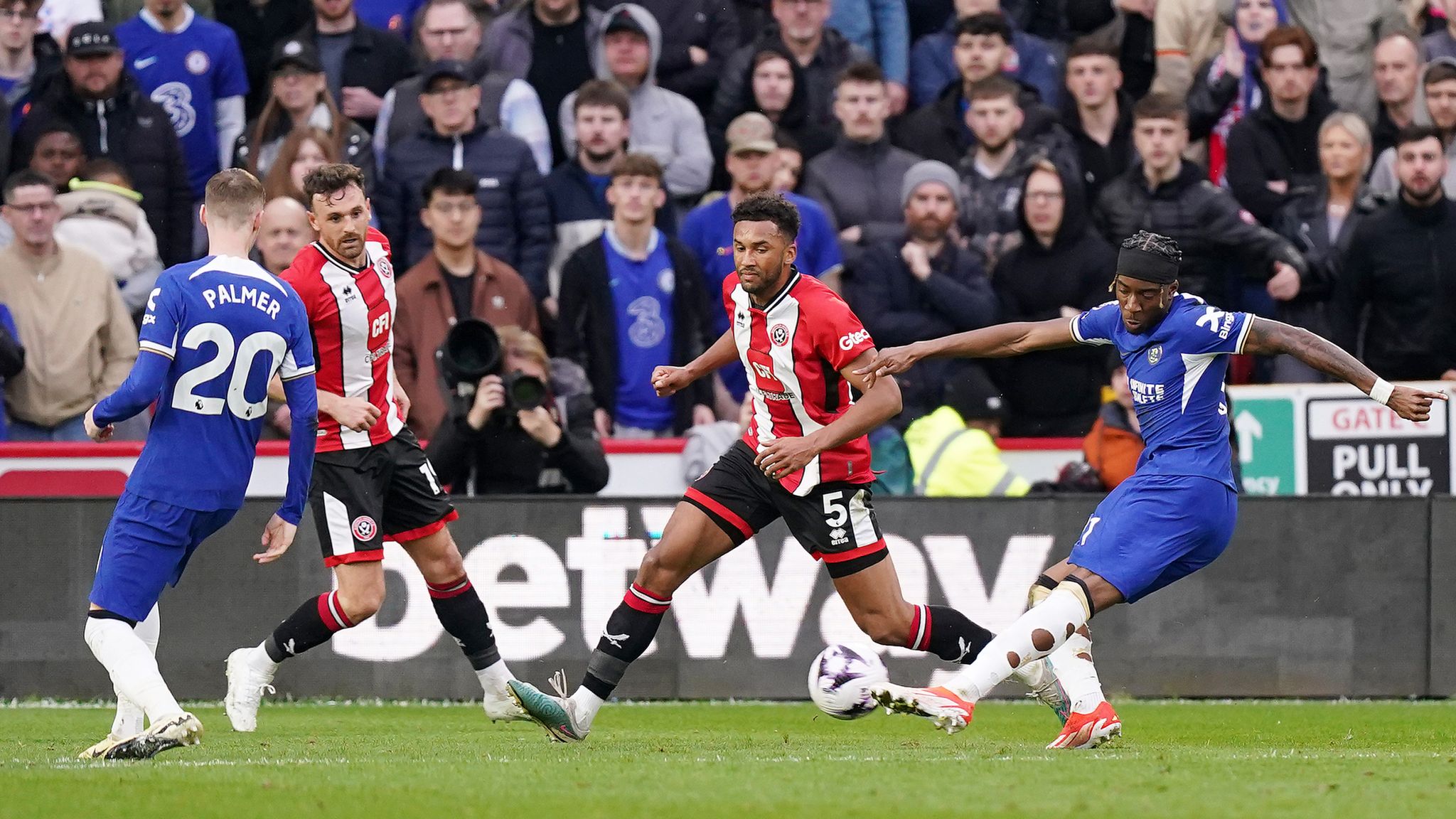 Noni Madueke (right) scores Chelsea's second goal of the game