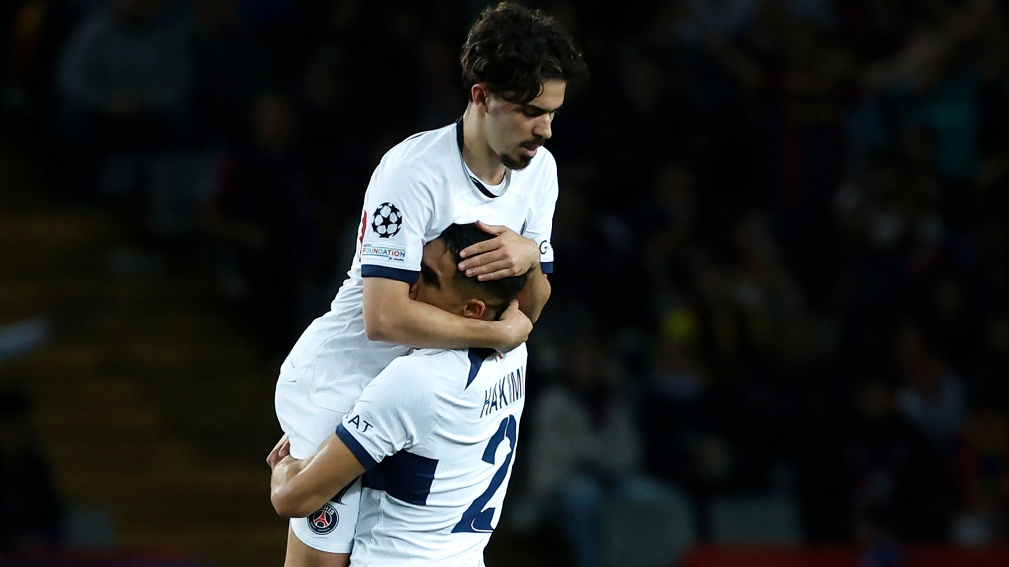 PSG's Vitinha celebrates with PSG's Achraf Hakimi