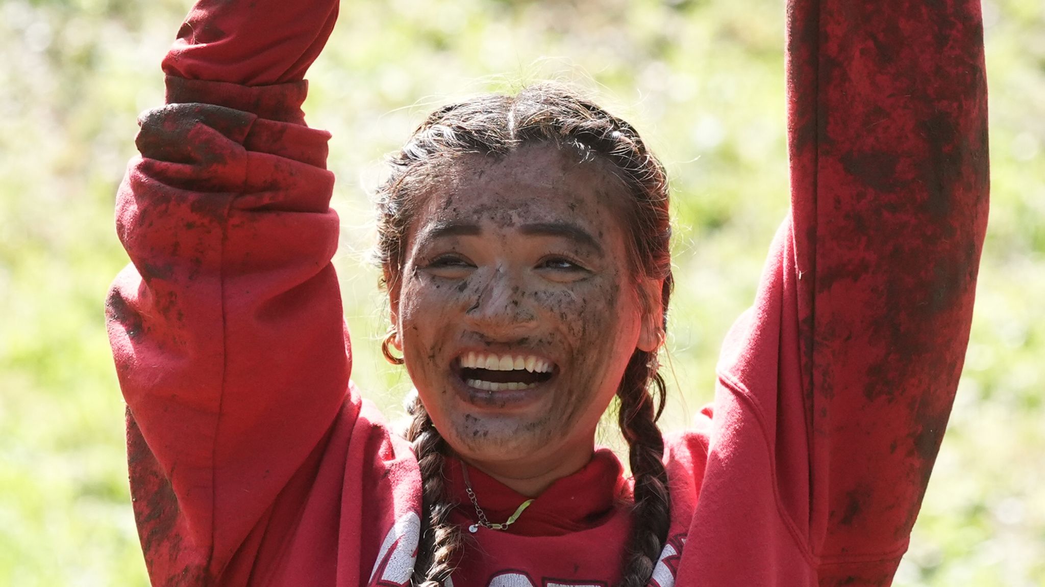 Abby Lampe got muddy way down to the bottom of the hill. Pic: PA