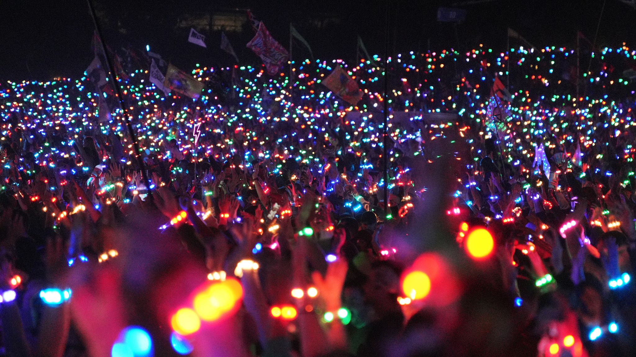 The crowd at Coldplay's headline set at Glastonbury Festival. Pic: PA