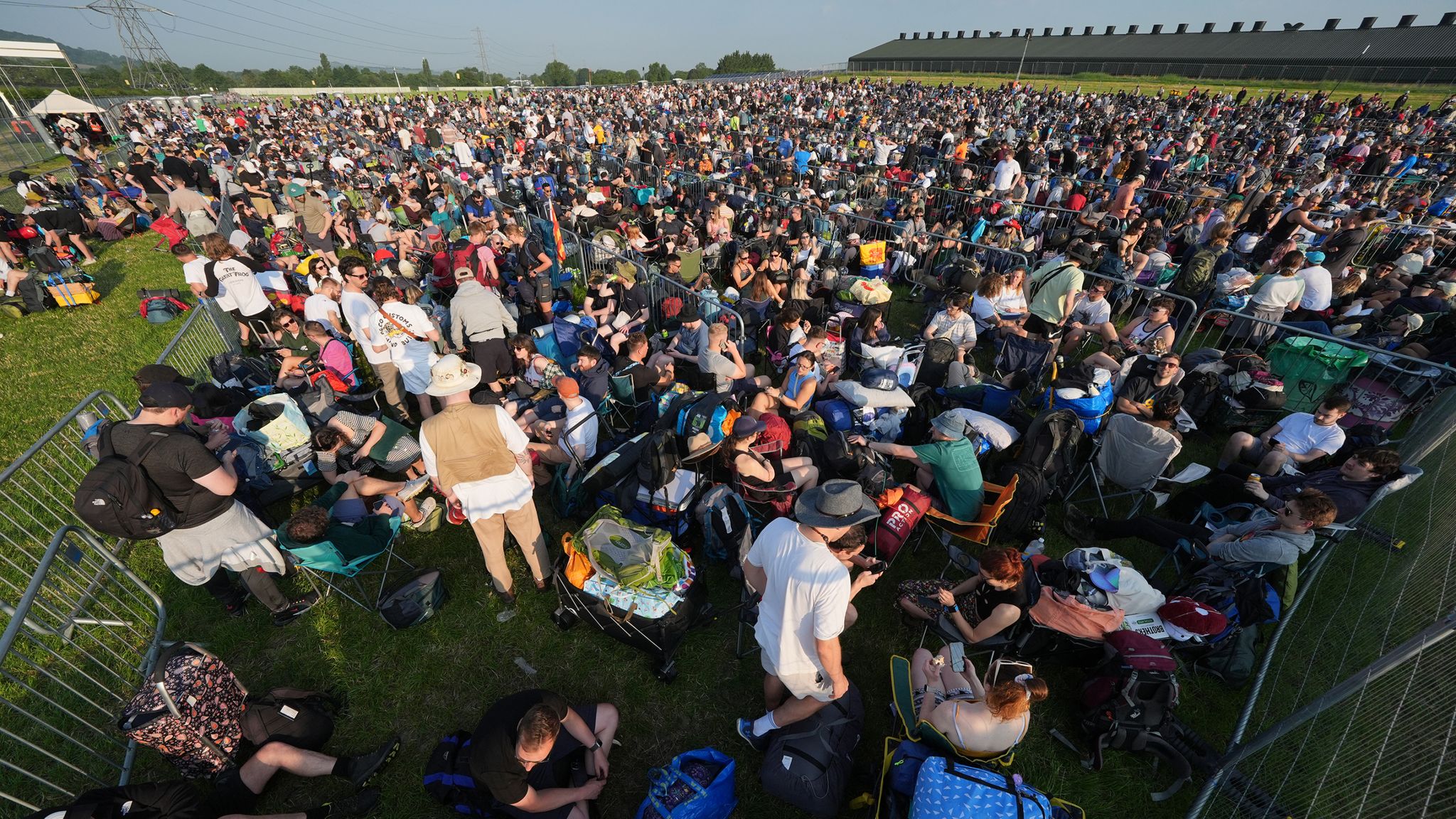 People queue for entry on the first day of the Glastonbury Festival at Worthy Farm in Somerset. Picture date: Wednesday June 26, 2024. PA Photo. See PA story SHOWBIZ Glastonbury. Photo credit should read: Yui Mok/PA Wire 