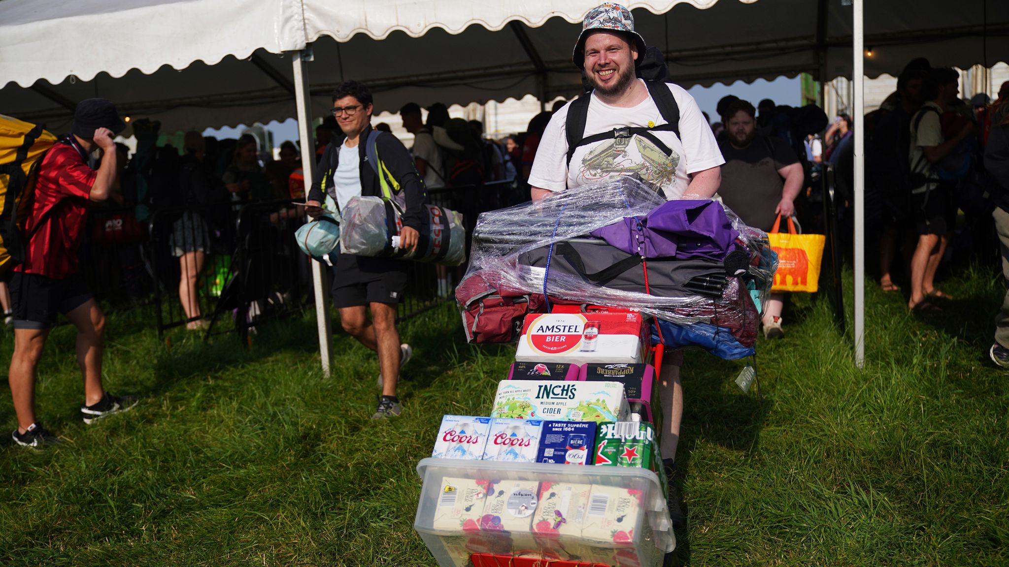 People arrive for the Glastonbury Festival at Worthy Farm in Somerset. Picture date: Wednesday June 26, 2024. PA Photo. See PA story SHOWBIZ Glastonbury. Photo credit should read: Yui Mok/PA Wire 