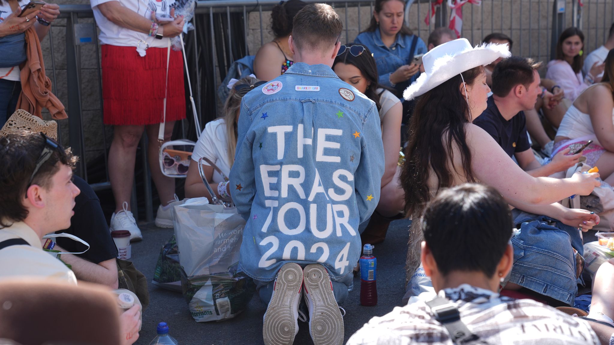 Fans wait outside Wembley Stadium in London, ahead of Taylor Swift's first London concert, during her Eras Tour. Picture date: Friday June 21, 2024. 