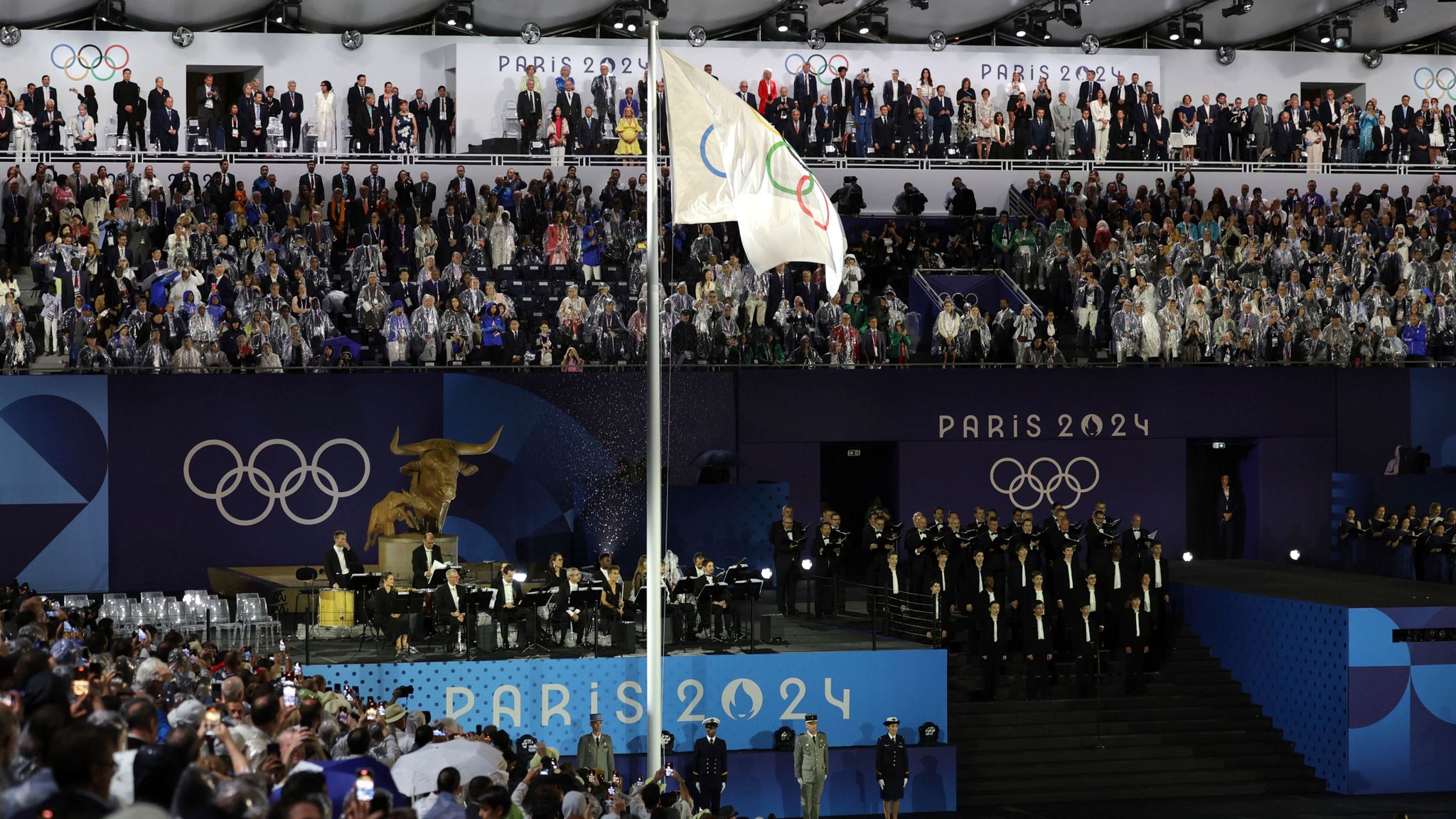 Olympic flag is raised during opening ceremony. Pic: AP